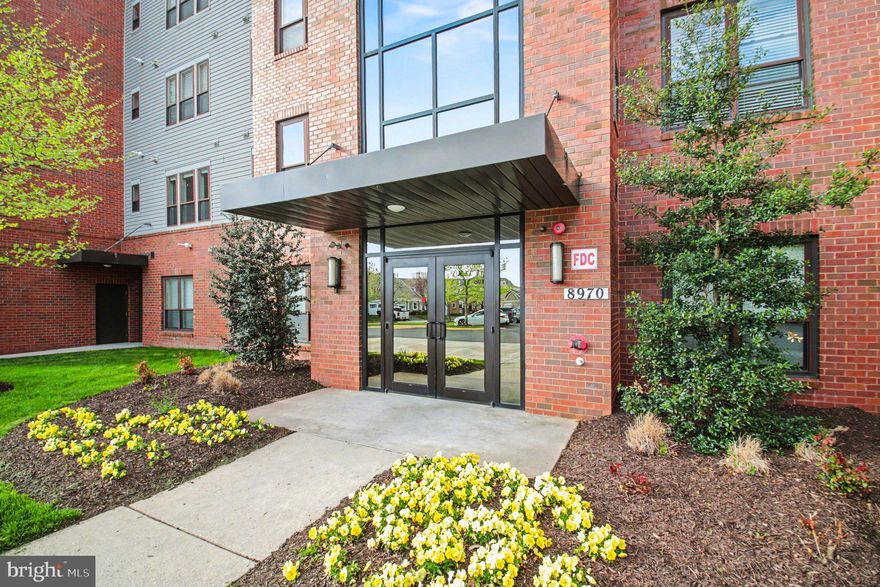 Welcome to the desirable 55+ community of Spring Hill in Lorton! This freshly painted corner unit 2BR/2BA condo offers 1,621 sq ft of spacious living and features a rare two-balcony layout—only a handful of units in the building have this! Enjoy a bright, open floor plan with a cozy fireplace and a large kitchen with granite countertops, stainless steel appliances, and a center island.

The primary suite includes a large walk-in closet with custom built-ins and a luxurious bath with double vanity, separate tub, and shower. Generous second bedroom and full bath provide flexibility for guests or office space. Oversized 1-car garage offers extra storage.

Ideally located near Liberty Market and Workhouse Arts Center, offering restaurants, shops, and local artists. Community amenities include indoor pool, fitness center, tennis courts, clubhouse, billiards room, and more. Gated community with beautifully maintained grounds.

Don’t miss this rare opportunity!