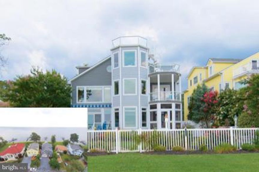 Amazing 270 degree views of the Chesapeake Bay.  Nestled in-between Herrington Harbour & North Beach w/ board walk & restaurants- true boaters paradise.  High end finished throughout, great room w/  2 story stone fireplace & walls of windows.  New gourmet kitchen w/ butlers pantry, hand scraped wood floors, crown molding. Elevator.  Master bath w/ heated floors & towel racks.  Roof top deck, dock.