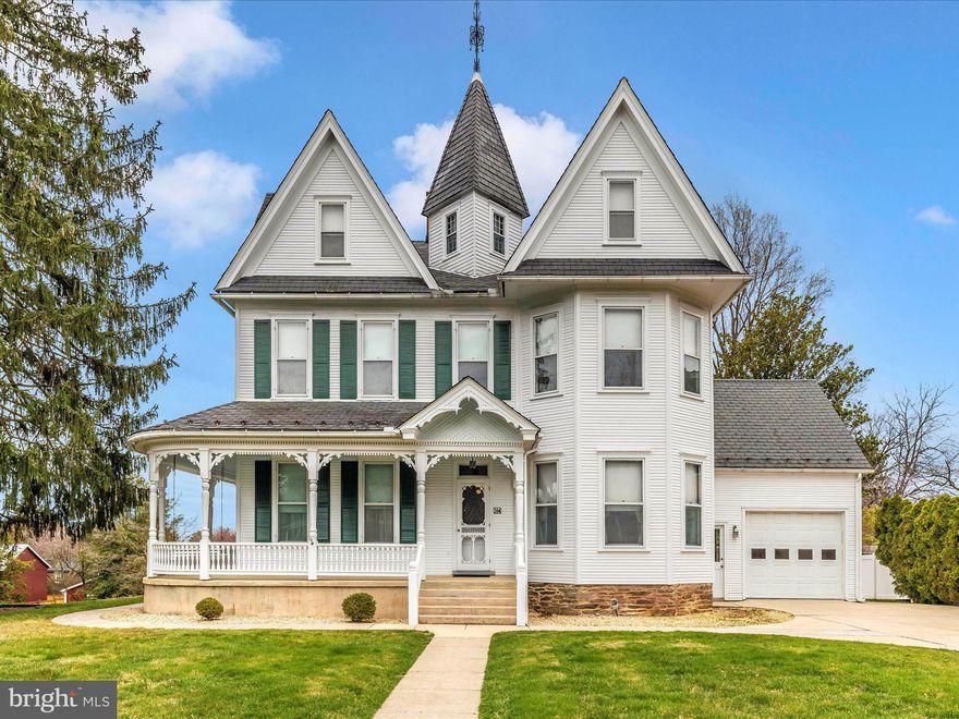 This one-of-a-kind Victorian Masterpiece could be yours! This house is loaded with original antique charm.  Enjoy evenings on the swing with this large wrap around front porch.  As you walk into this home you are greeted with original wood doors and woodwork throughout. There are gleaming pinewood floors and large wood baseboards. The spacious rooms on the first floor have ten-foot ceilings. On the first floor you will find an office/library with a decorative fireplace with built-in bookcases. Also, located on this floor is a large family room with large pocket doors and a separate dining room with a bay window. The kitchen is located at the rear and has custom built cabinets and a large peninsula. The kitchen leads to a first-floor laundry area with a full bath and access to the attached garage. One of the unique features of this house is that it has an eight-foot door off of the eat-in kitchen that leads to the enclosed back porch pantry area and outside patio. This home has a wide center hall with a stunning wood staircase that leads to the upstairs.  Midway up the stairs you will find another unique feature of this house with a full bath loaded with antique Victorian charm, such as wainscoting, a claw foot tub, a pedestal sink and an old time oak decorative vanity.  The upper level has nine-foot ceilings and all wood floors throughout. In the front is the main suite bedroom with an adjoining full bath. There is lots of space for family and guests in the other three bedrooms located on this floor.  The rear bedroom has an enclosed porch that was used as a walk-in closet or could be used for additional storage.  From this floor the attic staircase leads to another room that has many possibilities waiting for your finishing touch such as additional storage, art studio, art or craft room, or another bedroom. From there you can go into the full walk-in massive attic which could be used for storage or many other future possibilities. This house also has a full basement that is in beautiful condition and could be used for many other uses. There are two 200-amp electric services. There is a two zoned heat pump system. The oversized attached garage also has a staircase that leads to an additional unfinished room above the garage. There is a 22 x 20 paver patio off of the side porch. There is a 31 x 47 concrete patio that surrounds the inground pool that is no longer active. One side of this lot is fenced with a five-foot maintenance free plastic fence. There is a four bay fully insulated detached garage in the rear yard which also has electric and water service.