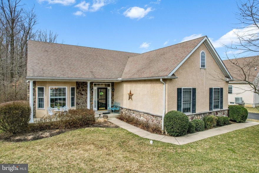 Set on a cul-de-sac, this 3-bedroom, 3 full-bathroom home feels private, buffered from through traffic and backing to open space, yet convenient to all the area attractions and restaurants. The home features an open floor plan for a casual, yet elegant lifestyle. As you enter the home, the first thing you will notice is the beautiful hardwood floors. To the left of the entrance is the dining room, which is the perfect space for entertaining. The gourmet kitchen is centrally located in the home and easily accessible to the dining room, and opens to the living room. The kitchen is complete with spacious cabinets, granite countertops, a tile backsplash, stainless-steel appliances and counter space for casual dining. From the kitchen, you have a clear view of the gas fireplace in the living room and will enjoy the benefits of the natural light that enters from the numerous windows. Continue through the eat-in kitchen area to the delightfully private rear maintenance free deck, which is ideal for warm weather entertaining. Further inspection leads to a generously sized master suite with a walk-in closet and full bathroom offering two vanities, soaking tub and separate stall shower. An additional bedroom, full bathroom and laundry room, complete the main level. This home's versatile flex space on the first floor can serve as a private home office depending on your needs. Indeed, there is no lack of space in this home as you continue downstairs to a beautifully finished lower level with recreation room, third bedroom and full bathroom. This spacious home has been meticulously maintained by the owners and offers a maintenance free lifestyle. Recent updates include a new dishwasher, garbage disposal and sump pump. Belmont is a five-star community; the HOA  includes lawn care, snow removal, trash removal, mulch, tree trimming, and club house.