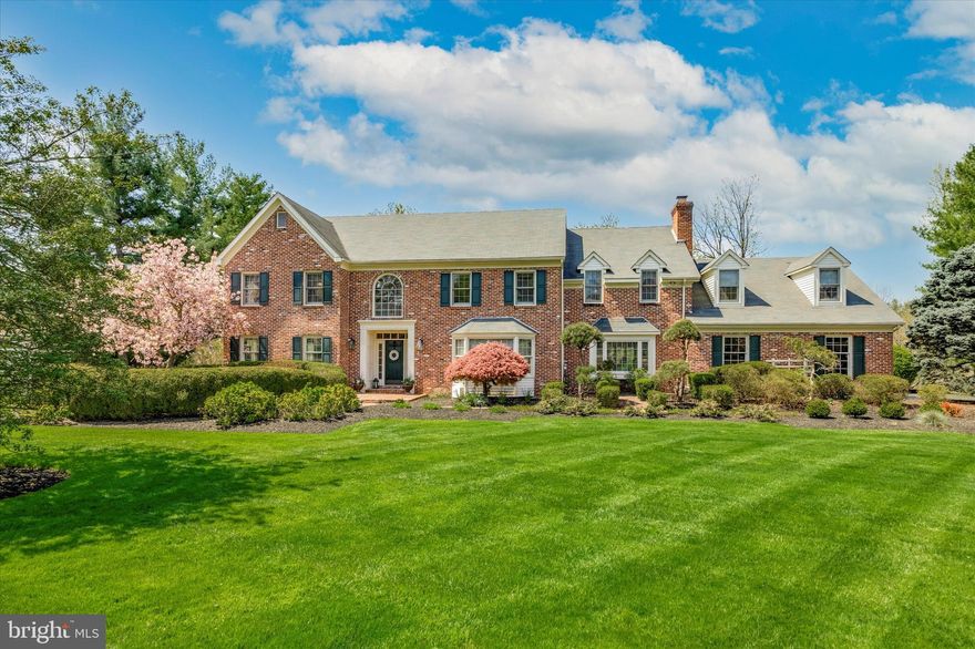 Are you ready for your dream home?!
Built by Tom Sweeney, sitting on more than an acre in the heart of Lower Gwynedd, enjoy a sublime setting at the end of a cul-de-sac backing up to the Wissahickon Watershed Preserve in the highly sought-after community of Forest Hill.  You will find a gorgeous home situated on grounds planted and maintained with the utmost care. With flowering trees and sumptuous lawns, a sparkling swimming pool, attached hot tub and paved terraces, you might spend a whole day relaxing outside! 
But go inside this 5 bedroom, 3 full and 2 half bath home and you will find over 6,200 sq ft of beautifully finished space, with a flow that is perfect. There are solid oak hardwood floors through most of the home except the foyer and bathrooms which have tile, and the fifth bedroom which has carpet. Stepping inside the front door you find yourself in a two-story foyer with a statement staircase to the second floor. To the right and left of you are a living room and a formal dining room, both of exceptional size and featuring custom wainscoting and a wood burning fireplace in the living room. Through the foyer to the chef’s kitchen, you have reached the real heart of the home. Spectacular with a 12’ granite countered cherry island housing a Dacor six burner gas cook top, a pop-up extractor fan, a prep sink, lots of storage and room for 6 bar stools. Some people might be happy with just the island, but surrounding it is plenty more storage in cherry cabinets with granite countertops, a Dacor double oven, Miele dishwasher, KitchenAid refrigerator and a Marvel wine cooler (all stainless steel) and a double sink all surround the island and make this space a joy to prepare food and entertain guests. The kitchen is open to a huge, vaulted ceiling sunroom with skylights and a wall of windows overlooking the pool area, the backyard and the Preserve. Off this sunroom and connected to the formal living room by double doors is a good-sized office with built-in bookcases. On the other side of the sunroom is the original sunroom for the house. Presently used as an office, it could be repurposed as a sunny sitting room (with built in wet bar) or play area (lock up the wet bar!).  A hallway from the kitchen leads to a spacious half bath and on to the family room which has a huge wood burning fireplace. A second stairway leads from the old sunroom upstairs. Halfway up the stairs is a large cupboard door which leads to an enormous storage area over the garage.
Up to the second floor from the foyer or the back staircase we find 5 bedrooms including the owner’s suite, plus two full bathrooms and an upstairs laundry room. The owner's suite is breathtaking: an enormous bedroom with wood burning fireplace (number three!), a bathroom beyond the imagination and a magnificent walk-in closet. The bathroom has a clawfoot slipper tub, a huge glass enclosed shower, a linen closet, double sink vanity and room for a makeup table. The toilet is tucked away beyond the shower. All this in a spacious room with Carrera marble floor, wainscotting and tiling in the shower. The walk-in closet is off the bathroom. It features custom built in cabinetry and has enough space for a seat and a window!
The four spacious secondary bedrooms all have good closet space and share two hall bathrooms. The laundry room has the appliance hook ups enclosed in a closet, and has a cabinet topped with a clothes-folding area.
Accessed from the family room is a very large three and a half car garage. Enough room for your cars and your toys!
Going downstairs from the foyer on the main level takes you to the basement, which has a large, finished space and an unfinished space housing the HVAC system, water heater and a spacious storage area.  There are two parts that are finished. One is home to a sitting area, a wet bar, a pool table and a ping pong table. The other is home to a workout area.  A half bath completes the basement.  
Come and live the dream!