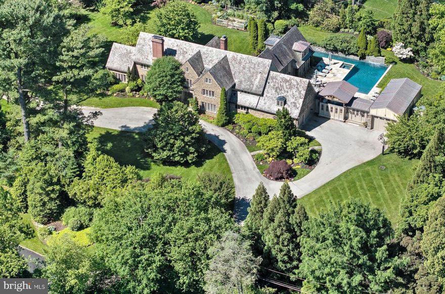 Nestled in one of north side Haverford's most desirable locations, 306 Brentford Rd stands as a testament to timeless elegance and modern luxury. This classic estate home underwent meticulous renovations in both 2001-2002 and 2016, ensuring it remains at the pinnacle of sophistication.

From top to bottom, this home has been thoughtfully upgraded and redesigned, including the addition of several rooms such as the breakfast room, family room, guest room, leather mezzanine hallway to the guest suite, guest suite, yoga room, and exercise room. The expansion seamlessly blends with the original structure, enhancing both its functionality and charm.

Step outside into your own private oasis, where an inviting inground pool awaits, complete with a 25-meter lap lane, tranquil waterfall, and cabana with climbing gym. A covered Pavilion featuring a sink and grill, is perfect for hosting gatherings or unwinding after a long day.

Inside, the grandeur continues with a center hall colonial layout that includes a formal dining room, a library with fireplace, and a fireside living room that seamlessly transitions into a well-appointed office space. The gourmet kitchen boasts a large center island, top-of-the-line appliances, and a walk-in pantry, while an addition provides additional living space, including a two-story breakfast room, home office/library, and den with built-in cabinetry. 

Upstairs, the primary suite is a sanctuary unto itself, offering a spacious sitting room, a luxurious spa-like bath with double sinks, a freestanding tub, a double shower with frameless glass enclosure, and ample closet space.

Additional highlights of this remarkable property include ensuite bedrooms, a finished lower level with a laundry room and exercise area, and a third floor with versatile living spaces and a full bath.

The meticulously landscaped gardens feature flowering beds that bloom from March to October, multiple terraces for outdoor enjoyment, and original antique doors sourced from a London bank that adorn the patio pagoda. Magnificent plantings include specimen trees, some over 100 years old. 

With geothermal heating, new Hope's windows, and a Tesla charger in the garage, this home seamlessly blends modern convenience with timeless charm.

Don't miss the opportunity to make 306 Brentford Rd your forever home.
