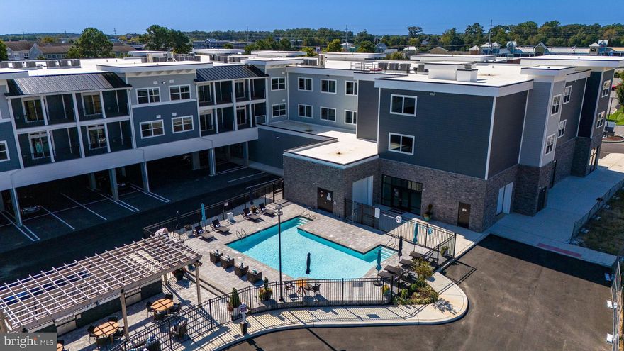 **Photos shown are of furnished sales model with the same floor plan.**Unique and limited opportunity to own one level new construction East of Route 1 in Rehoboth Beach, Delaware. These elegant upscale condos feature Quartz countertops, stainless steel appliances, 42 inch kitchen cabinets, butler's pantry and dry bar, led downlighting, walk in closets, coastal luxury flooring, nine foot ceilings, tile showers with glass enclosure, custom interior molding and doors, full size stacked washer and dryers and private balconies. The community amenities include a beautiful fenced in pool, outside grill, gazebo and firepit, gated covered parking spots, and an enclosed dog run. Residents also have private access to co-working spaces, conference rooms, a beautiful lounge space, a fitness center, a coffee station, storage lockers and a bike storage room. The building has two convenient elevators and common spaces for mail delivery and trash pick up.  Sales center on site Friday - Monday 10:00 am - 4:00 pm.  The community is located within a quick walk or bike ride to the outlet center and Breakwater bike trails as well as a quick car ride to the beautiful coastal beaches and State Parks of both Rehoboth and Lewes. Unit 210 is the Retreat Floor Plan. Low property taxes - only $1272.28 annually. Limited time incentives - inquire for details.