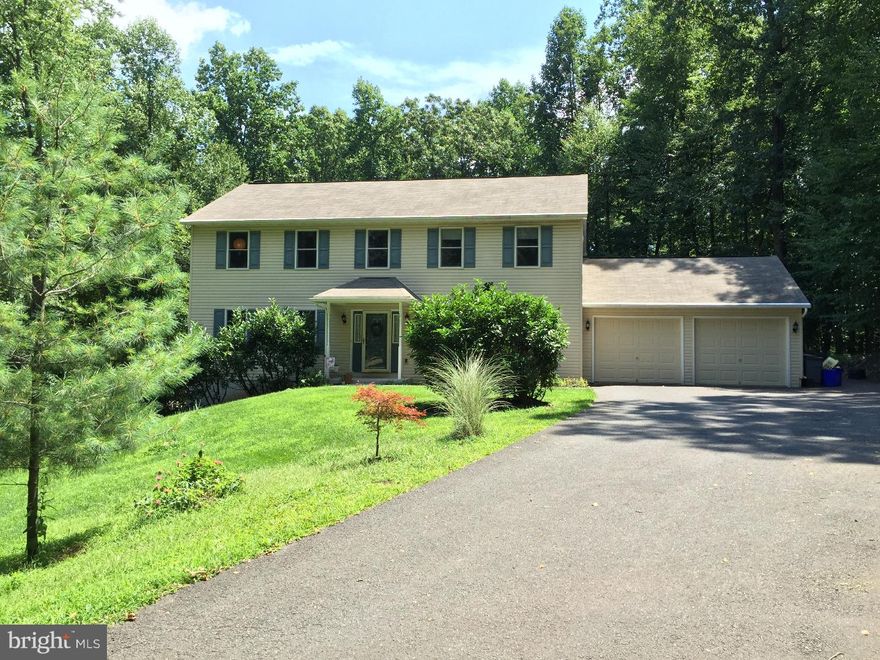 Amazing Colonial surrounded by trees and privacy! This 4 plus bedroom home sits back off the street with just unbelievable views. Two car garage with plenty of parking in multiple parking areas. As you enter this beautifully designed home with an open layout and plenty of space,  you will instantly fall in love. This is not just a house; it is YOUR HOME... The first floor includes a possibility for another bedroom with full bath attached. Once you head upstairs,  you will see your Master Suite with a full bathroom and bonus balcony deck overlooking your beautiful backyard. All bedrooms are generously sized. Your walk out basement features over 10 foot high ceilings and spans the entire floor plan of the home. For your added comfort, a bonus wood/coal furnace that is linked into the duct-work and your own generator are included! Just off your open kitchen is an over-sized freshly painted deck that leads you out to your in-ground pool.  You also have a large shed just beyond the pool. This lot is cleared enough for great views, and yet provides privacy all around with woods just beyond. Close to many stores, highways, the turnpike, and schools. This home won't last! A full one year Home Warranty with an acceptable offer. Book your showing NOW!
