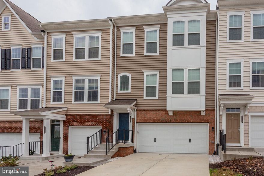 Gorgeous Town home tucked away in one of the most ideal locations in Ashburn nestled across from 124-acre Bles Park with trails leading to the Potomac River.  The Town home is minutes away from One Loudoun commuter's routes and Dulles International airport. This popular Surrey Model Boasts 9 feet ceiling, with a 4 bedroom and 3.5 bathrooms, beautiful gourmet kitchen with tile backsplash, stainless steel appliances, granite countertops. Engineered hardwood floors on all levels throughout the town home. Washer/Dryer. Upper-level laundry closet with folding station, storage space and separate storage closet. Other improvements include remodeled half bath, upgraded lighting, attic insulation and much much more . Fully fenced back yard with porcelain tile patio and spacious 20 feet X  14 feet premier Trex deck.  Lower level fully finished with 3 Full bath and 4th bedroom.