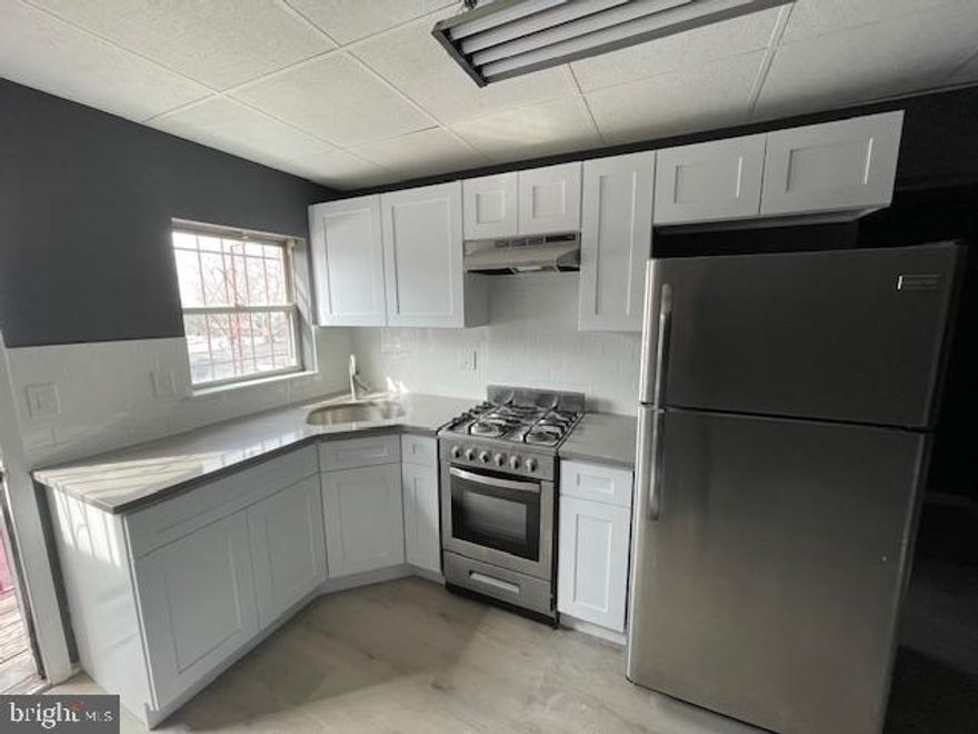 Live at 3534 Wharton Street, a recently renovated 1-bedroom, 1-bathroom apartment in the Grays Ferry section of Philadelphia. This spacious third-floor unit stretches the length of the building and features durable carpeting in the bedroom and living area, a modern kitchen with marble countertops, stainless steel appliances, and ample cabinet space. The stylishly tiled bathroom includes a full tub, and a private deck off the kitchen offers extra outdoor space. Conveniently located near public transportation, I-76, and University City, this apartment is perfect for commuters.