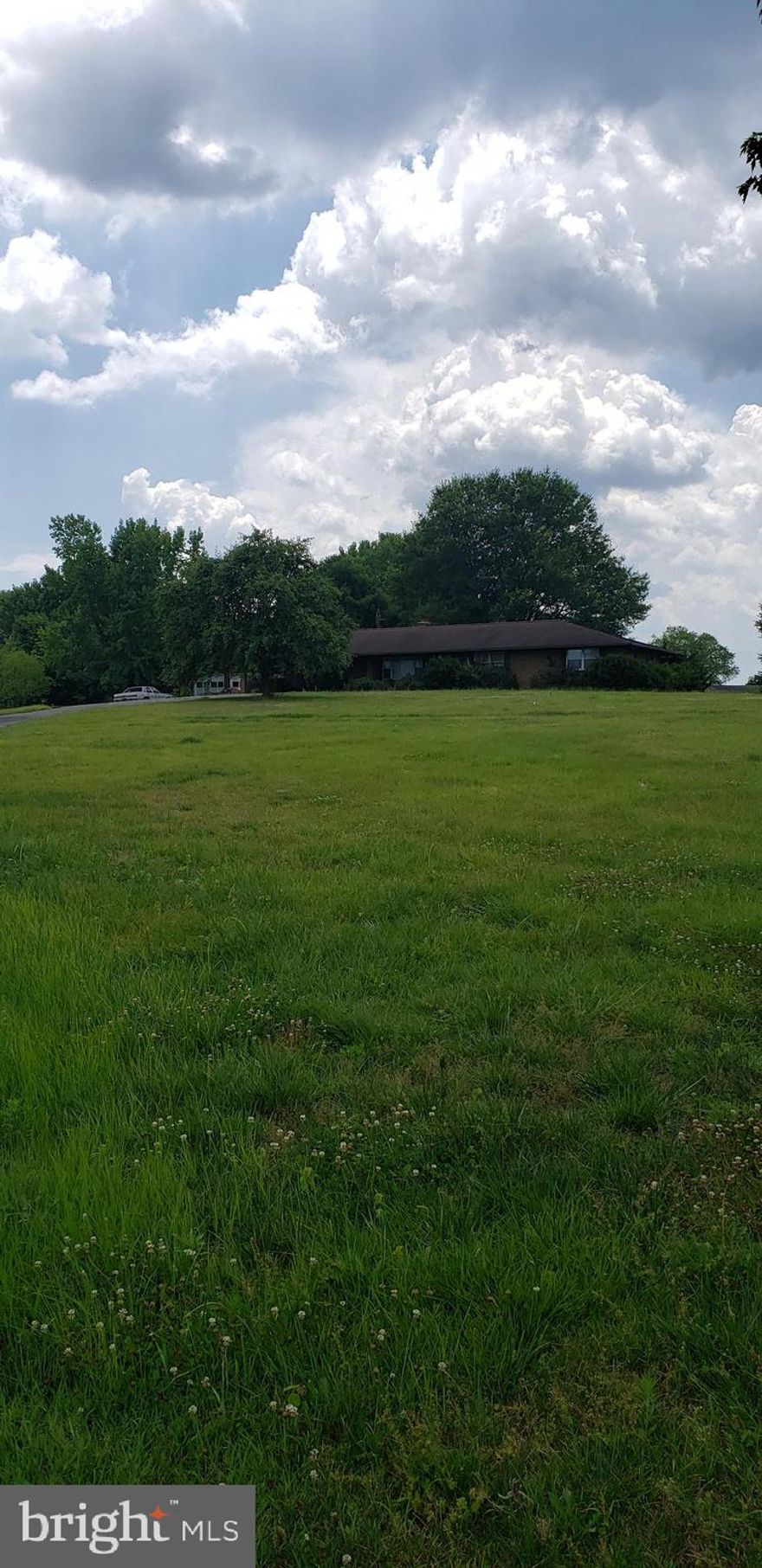 Sellers very motivated!! This 3 bedroom has lots of land with fruit trees. with a little work , you can restore the house to its oringal GLORY