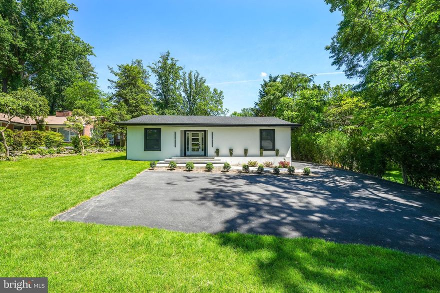 Open House Sunday 2:00 to 4:00pm! Introducing a breathtaking embodiment of modern living in Falls Church, VA, this Cozy Modern Home is a testament to architectural brilliance and meticulous craftsmanship. Built upon an existing foundation, every inch of this contemporary sanctuary has been touched and refined to perfection, offering a living experience that resonates with passion and elegance.

Spread across just under 3000 sqft, this home unfolds into an open, modern space accentuated by high ceilings, 5 strategically placed skylights, and a bespoke wine display that captures the essence of sophistication. The heart of the home, a chef's modern kitchen, is adorned with European style custom cabinets, a large island with quartz countertops featuring a sleek waterfall edge, setting the stage for culinary adventures and memorable gatherings.Equipped with Monogram Stainless Steel Appliances including a built-in refrigerator, wall oven-microwave combo, dishwasher, and chimney hood, every detail caters to a lifestyle of convenience and elevated taste.

The primary bedroom is a retreat within itself, featuring walk-in closets and a spa-like bathroom illuminated by a skylight. Indulge in the luxury of a soaking tub, dual vanities, and the tranquility that this private space offers.

The basement extends the living space with a recreation room, a full bathroom, and additional storage, perfectly blending functionality with design.

Externally, the white stucco facade contrasts beautifully with black windows, soffits, and trims, creating a striking salt & pepper blend that exudes modern charm. The property sprawls over a 15,000 sqft flat lot, complete with a detached 2-car garage.

The professional landscaping surrounds the home with privacy trees, new sod, and mulching, creating an oasis of tranquility. The approach to the home is defined by a concrete and natural stone walkway leading to the front porch, while the backyard invites relaxation and entertainment on modern concrete pads.

This Cozy Modern Home is not just a residence; it's a lifestyle choice for those who seek modernity, comfort, and a connection with their living space. Discover the opportunity to make this house your home and create a life filled with beautiful moments and serene living. Agent has financial Interest.