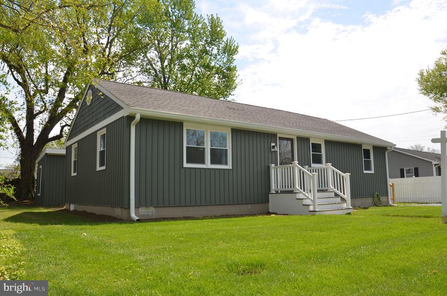 Essentially a NEW HOME! Extensively, tastefully and professionally renovated 1965 rancher located on a quiet residential street, just 2 blocks from downtown St. Michaels. Nearly everything is brand new, including roof shingles, siding, windows, HVAC system and new deck. New off-street parking area, sized for 2 vehicles. Inside, everything looks (and is) new, too, including attractive luxury vinyl floors throughout, spacious kitchen w/all-new stainless Whirlpool appliances (range; refrigerator w/ice; dishwasher; built-in microwave oven), separate laundry room w/stacked washer/dryer, powder room, full bath, living room, dining/family room and two bedrooms with good closet space...all on one level! The house is attractive,  comfortable and bright inside. Sliding glass doors off the family room lead to a new deck, overlooking the private back yard, where you will see a substantial renovated shed, approximately 20' x 15'...perfect for use as a workshop and/or garden shed and storage area. "Move-in Ready!"