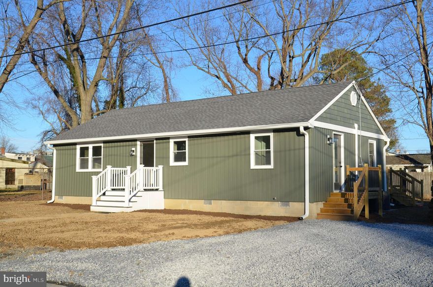 Essentially a NEW HOME! Extensively, tastefully and professionally renovated 1965 rancher located on a quiet residential street, just 2 blocks from downtown St. Michaels. Nearly everything is brand new, including roof shingles, siding, windows, HVAC system and new deck. New off-street parking area, sized for 2 vehicles. Inside, everything looks (and is) new, too, including attractive luxury vinyl floors throughout, spacious kitchen w/all-new stainless Whirlpool appliances (range; refrigerator w/ice; dishwasher; built-in microwave oven), separate laundry room w/stacked washer/dryer, powder room, full bath, living room, dining/family room and two bedrooms with good closet space...all on one level! The house is attractive,  comfortable and bright inside. Sliding glass doors off the family room lead to a new deck, overlooking the private back yard, where you will see a substantial renovated shed, approximately 20' x 15'...perfect for use as a workshop and/or garden shed and storage area. Final construction touch-ups projected to be completed on or about February 12. This will be a turn-key home for the next owner!