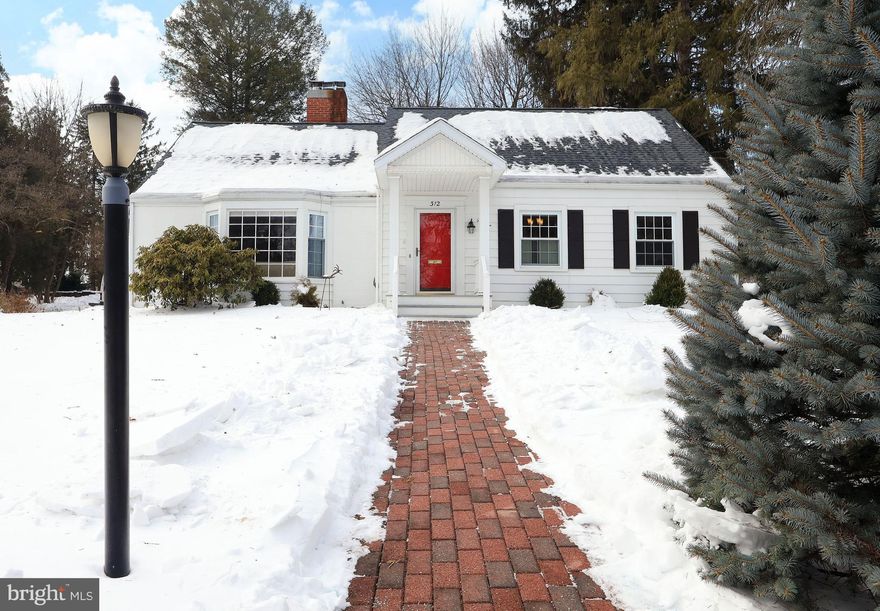 OPEN HOUSE, Sunday, Feb 15th - 10:30 am - 12:00 pm! There is a sweetness to mid-century homes that is rarely captured in modern construction; a use of every nook and cranny approach, an attention to details, and a sense of home as the generations of giggles and happy memories fill the spaces. 312 S. Buckhout St, State College is one of those homes. Built in 1951 this classic SC borough cape cod is located in the highly desirable Holmes Foster neighborhood and features hardwood floors, lots of built-ins adding charm and convenience, a traditional floor plan, and fun vintage flair. As you enter you'll note the retro stone floors in the foyer with boot box and cute brass mail slot in the bright cherry red door. Spend cozy evenings in the light and bright living room with hardwood floors, bay window, and wood burning fireplace. Share everything from holiday meals to weeknight dinners with your loved ones in the beautiful dining room with big windows, built-in sideboard and bar, and access to the darling heated sun porch, with new windows, perfect for your first cup of coffee or snuggling up with a good book on a sunny afternoon. From the sun porch you can access the oversized 2 car garage with workshop or exit to the large back deck ideal for summer fun and hosting neighborhood BBQs. Working from home is a breeze in the stately first floor office with built-in bookshelves, wood shutters, and chair rail accent. You'll appreciate the ease and functionality of the well appointed galley kitchen with new LVT flooring, granite countertops, white cabinets with glass front accent cabinet, SS appliances, pull-up counter area for quick breakfasts, broom closet, and kitchen sink view of the backyard. Two nicely sized bedrooms with hardwood floors and a cute updated retro full bath with tub/shower and tile complete the first floor. Upstairs you'll find a delightful primary suite, where you can steal away at the end of a long day, featuring an enormous walk-in closet with additional eave storage space, a sweet dressing area nook, new carpet, and a beautifully updated private bath with dual bowl sinks, walk-in tiled shower, new skylights, jetted tub with designated HWH, and tile floors. When you need a bit more space for hobbies or movie nights, you'll love having the finished lower level family room with built-ins as well as the convenience of great unfinished storage areas including a pantry. Warm days will be spent enjoying the fabulous large flat fenced yard with both person and mower sized gates, a large 1 year old deck with raised garden box, a fabulous mature maple tree that provides natural shady areas and great charm, lovely perennial gardens including roses, and lots of space for play! With a newer roof (3 years old), radon mitigation, fresh paint, 1 year old natural gas furnace and hot water heater, water softener, and additional gas appliance hookups this home has been lovingly updated for both mechanics and charm. Beyond the home itself you'll love being located in a sweet quiet neighborhood, with Corl Street Elementary and the high school close by, but also just blocks from the heart of downtown with all of its fabulous restaurants, shops, and events throughout the year from football weekends to Arts Festival there is always something happening. You'll feel right at home in no time!