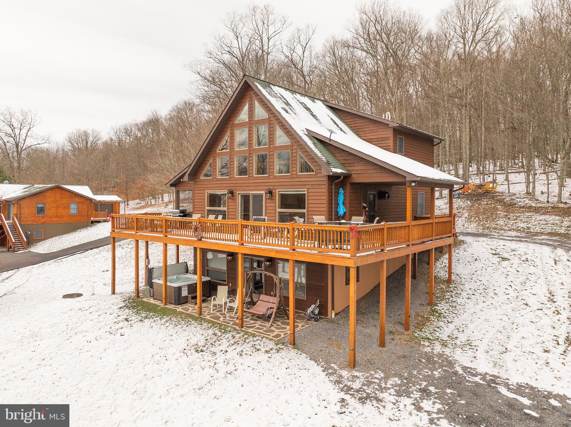 Welcome to 199 Sears Lane, a beautiful mountain chalet located in Sunview Heights near the southern end of Deep Creek Lake! Wonderful mountain views await as you relax on the expansive wrap-around deck, unwind around the fire pit, or soak in the hot tub! Inside the home, you will be greeted by an open, main level floor plan flowing from the living room to the dining and kitchen area, along with 2 bedrooms and a full bath. Upstairs, you will find a cozy loft and the large primary bedroom with a private balcony and attached bath. The lower level of the home offers an additional family room complete with a pool table, wet bar, and a stone fireplace. You will also find two bonus rooms in the fully finished lower level! Recent improvements to the home include a brand new HVAC system, new hot tub, and new kitchen appliances! Located in close proximity to Thousand Acres Golf Course and Deep Creek Lake! Call today to schedule your private tour!