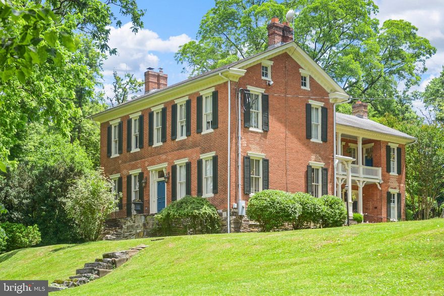 Historic Charm meets Modern Comfort on Five Gorgeous Acres at Linganore Farm!  One-of-a-kind character and timeless elegance abound in this stunning all-brick home – listed on the National Register of Historic Places - nestled on five peaceful acres of your own private retreat. Even with the isolated setting, Downtown Frederick, shopping, and more are just minutes away! Step inside and you’ll be greeted by gleaming wood floors, soaring 11-foot ceilings, light dispersing transom windows, and exquisite decorative molding throughout. The home boasts five substantial bedrooms and five and a half bathrooms, including three en-suite bedrooms —potential for an enchanting bed and breakfast. The large, sun-filled kitchen is perfect for gathering, with plenty of natural light and space to create delicious meals and lasting memories. Grand and expansive, the dining room provides the ideal backdrop for elegant dinners and special occasions - opening to the covered back porch for effortless indoor-outdoor entertaining.  Cozy up to one of the two fireplaces with gas logs for instant warmth and ambiance. Enjoy your morning coffee, outdoor dining, or peaceful bird watching from one of three inviting porches. The recently painted trim, porches, and shutters enhance the home’s curb appeal while maintaining its classic integrity. Outdoors, your private oasis awaits. From its beautifully restored smokehouse and original root cellar to a second structure with the potential for an income-producing unit, this property offers a rare blend of classic beauty and versatile opportunities. Take a dip in the in-ground pool or explore the estate, with ample room for gardens, chickens, goats, and a thriving homestead. Established mature trees including pecan, walnut, maple, and paw paw provide shade, beauty, and seasonal bounty. Whether you’re dreaming of a serene lifestyle, creating your own food forest, or starting a business venture, this unique property is full of possibilities. With its rich heritage, stunning details, and peaceful setting, this grand lady is ready to welcome her next chapter. Don't miss your chance to own a piece of history—schedule your private showing today!