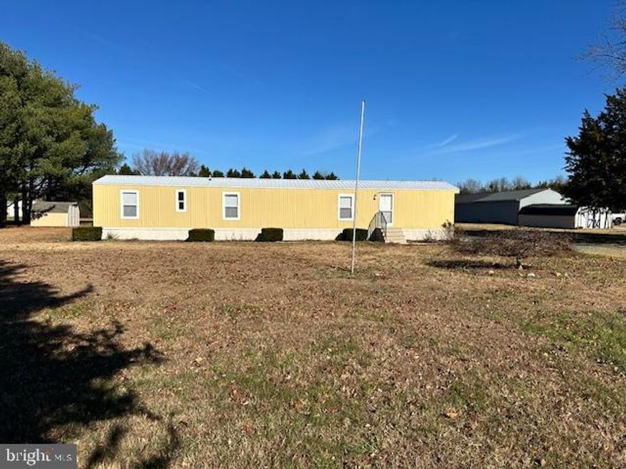 Discover the charm of this well-maintained 1993 Fleetwood manufactured home, offering a cozy retreat on a spacious 1.34-acre lot. With 980 sq. ft. of living space, this single-wide home features three inviting bedrooms and a full bathroom, perfect for relaxation and comfort.  Step outside to find a generous front and rear yard, ideal for outdoor gatherings or quiet moments in nature. The ample driveway provides off-street parking for up to four vehicles, ensuring easy access for you and your guests. This property combines the warmth of home with the potential for outdoor enjoyment, making it a perfect choice for those seeking a peaceful lifestyle, yet close to shopping and just 30 minutes to the area's resort beaches. Plenty of room for a shop / detached garage. No HOA fees or city taxes. Embrace the opportunity to create lasting memories in this delightful space!