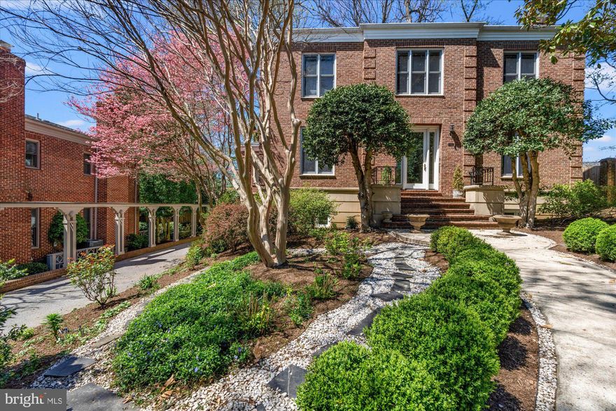A truly exceptional and rarely available offering, this stately 4-bedroom, 4.5-bath all-brick residence is gracefully sited in an exclusive and tranquil enclave. Located in the highly sought-after Berkley/Foxhall neighborhood, the home enjoys easy proximity to Georgetown, Downtown D.C., Reagan National Airport, and an array of acclaimed restaurants and local amenities.
Available for the first time in over 35 years, this classic home is in exceptional condition. The large entryway welcomes you with soaring ceilings. The main level features a formal living room, a spacious family room with access to a charming terrace for effortless indoor-outdoor entertaining, and a discreetly positioned powder room. The gourmet, eat-in kitchen is equipped with high-end appliances, abundant cabinetry and counter space, and is framed by custom wood shutters. A butler’s pantry connects the kitchen to a formal dining room, perfect for hosting gatherings with ease.
Upstairs, the second level offers three generously proportioned bedrooms and three full baths. The expansive primary suite includes two walk-in closets and a serene, sunlit ambiance.
The fully finished lower level boasts a large family room with a fireplace, an additional bedroom and full bath, a dedicated office or study, and direct walkout access. A long, private driveway leads to a two-car garage, surrounded by professionally designed grounds. Natural light pours in throughout the home, highlighting its thoughtful layout and graceful finishes.