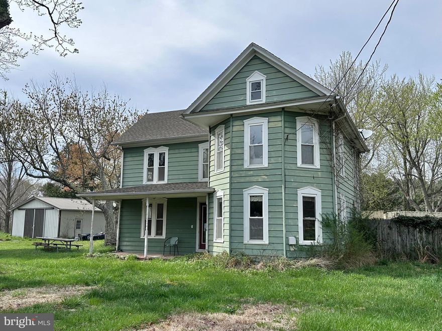 Bring your vision and creativity to this charming Victorian-style home, ready to be restored to its former glory. Offering over 2,000 square feet of living space, this unique property is full of character and opportunity. The welcoming front porch is perfect for your favorite rocking chairs and overlooks the spacious front yard.  Inside, you'll find a cozy den off the front foyer and an open-concept kitchen with generous counter space and a large center island with bar seating. The kitchen flows seamlessly into the living room, perfect for gathering and entertaining. Upstairs, the primary suite boasts a spacious en suite bath, accompanied by two additional bedrooms. A second full bath is conveniently located on the main floor, just inside the door leading to the in-ground pool—currently in need of restoration, but full of potential. Outside, the property features a detached garage offering ample space for vehicles, hobbies or a workshop. With over two acres, there’s plenty of room for gardens, animals, or simply enjoying the peaceful outdoors. Conveniently located just 5 miles from historic downtown St. Michaels and within minutes of multiple public boat landings, this home provides easy access to the Chesapeake Bay, Choptank River, and scenic waterways—perfect for boating, fishing, crabbing, or dining at waterfront restaurants. Bring your vision and expertise to restore this classic Victorian, offering tremendous potential for a stunning transformation. Whether you're looking for a full-time residence, vacation home, or investment opportunity, this property is a rare find for those with a passion for renovation and appreciation for the Eastern Shore lifestyle.