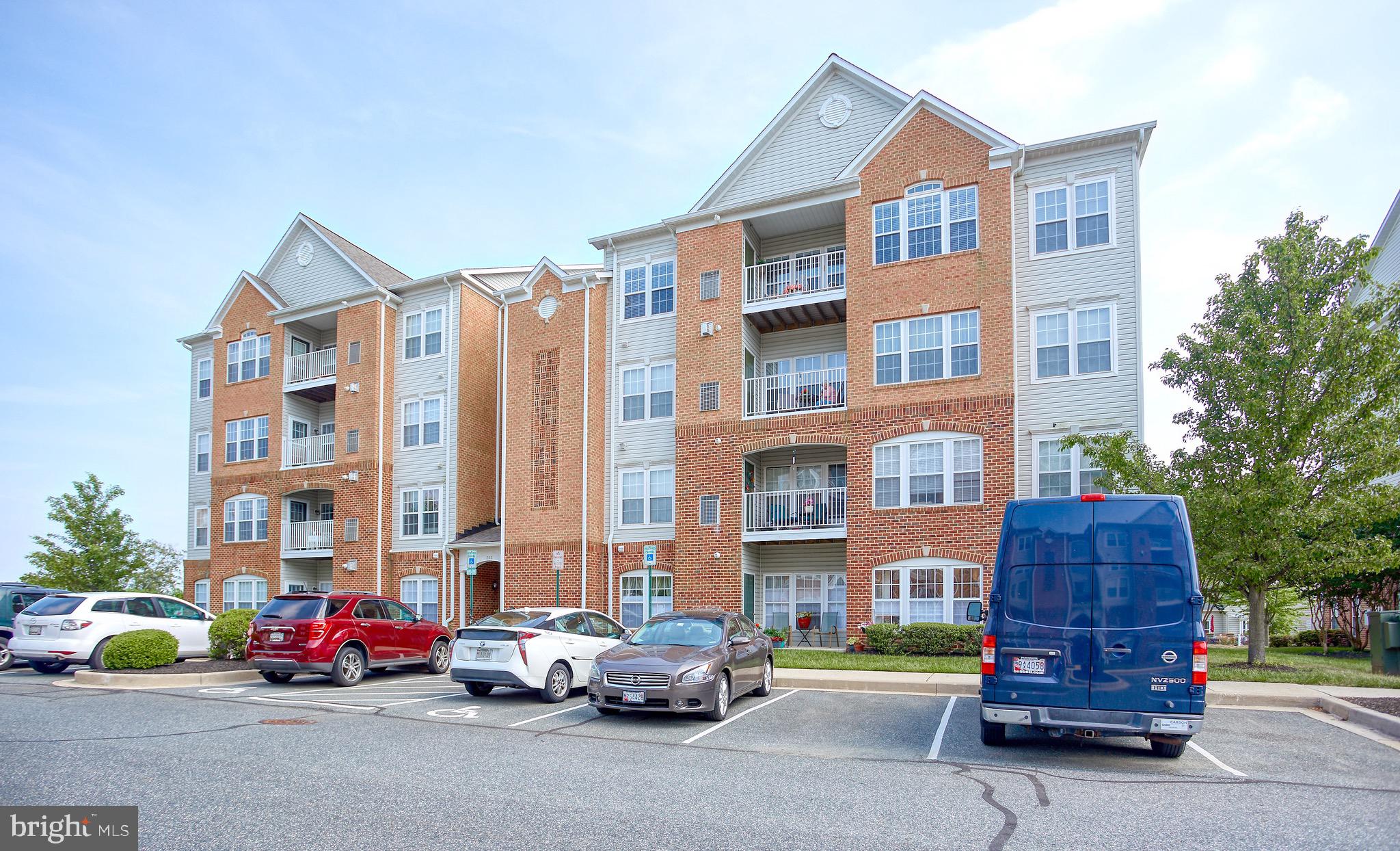 Fabulous penthouse condo in sought-after Bulle Rock! 2 bedrooms and 2 full baths. Recently painted bright and neutral and ready for your personal decor. All of the flooring was also replaced completing the updates on this move-in ready unit. Large master bedroom with en suite bath and extra sitting space. Large closets and plenty of storage. Sit by the gas fireplace and enjoy the spacious vaulted ceilings in this 4th floor condo. Community covers all lawn care, snow and trash removal - and provides a full gym, indoor and outdoor pools, tennis, billiards and much more in the 37,000 sq ft Residents' Club. Walking trails, playgrounds, discounts on golf and more in this one-of-a-kind community.