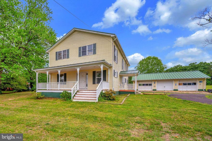 Welcome to this beautifully updated farmhouse-style home where timeless charm meets modern convenience. Originally built in 1940 and thoughtfully expanded in 2005, this spacious residence offers over 3,200 square feet of well-designed living space filled with warmth, character, and functionality. With four generously sized bedrooms and three full bathrooms, there is plenty of room for everyone to spread out and feel at home.

Inside, you’ll find a welcoming blend of hardwood, dual staircases, tile, and carpet flooring that creates a comfortable and inviting atmosphere throughout. The heart of the home is the impressive kitchen, featuring granite countertops, a luxury appliance package to include: gas chef-style cooktop, double ovens, dishwasher, and refrigerator — perfectly designed for everything from casual family dinners to entertaining guests.

One of the standout features of this property is the flexibility of having two primary suites, including one conveniently located on the main level and another upstairs, both complete with private en-suite bathrooms. Each additional bedroom offers generous space, abundant natural light, and comfortable accommodations.

Situated on a peaceful and level 1.81-acre lot, the outdoor space provides endless opportunities to relax, entertain, garden, or simply enjoy the surrounding countryside. Spend your mornings on the covered porch with a cup of coffee or host gatherings on the spacious deck overlooking the cleared backyard.

Car enthusiasts, hobbyists, and small business owners will appreciate the oversized detached garage/shop with room for up to three vehicles, along with extensive driveway parking for guests, equipment, or recreational vehicles.

Offering the perfect balance of historic farmhouse charm and expanded modern living space, this property combines the character of an older home with the added comfort and functionality of newer construction. With no HOA, you’ll have the freedom to truly make the property your own. If you’ve been searching for a home with space, flexibility, outdoor privacy, and timeless appeal, this exceptional property is ready to welcome you home.