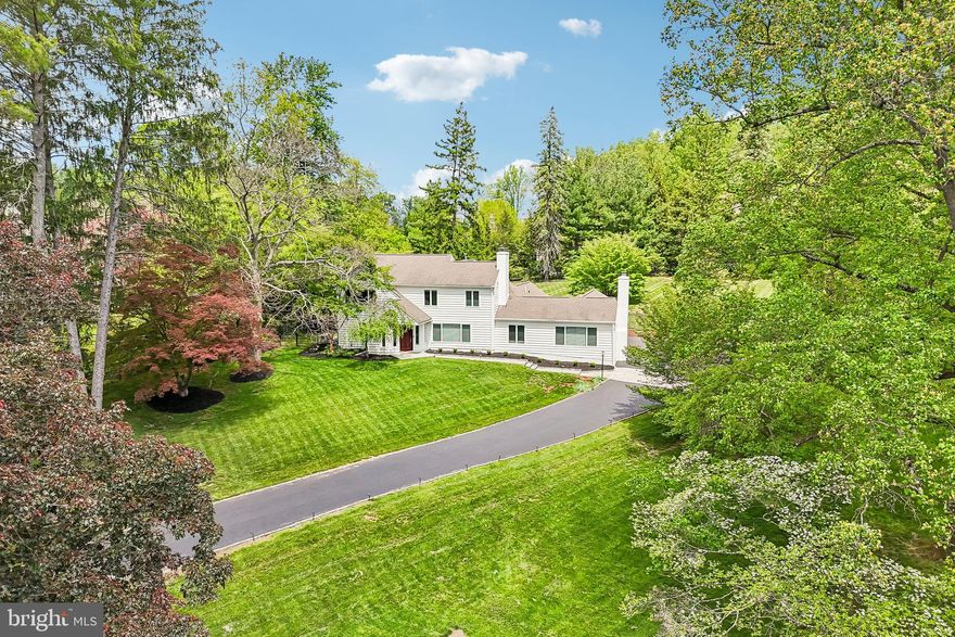 Enter the front door of this custom-built home and prepare to be amazed by the abundance of light, the architectural features, and the attention to detail! Introducing 38 Dunminning Road, a stunning 4 bedroom, 4.2 bath home nestled on a beautiful 1+ acre lot on a private cul-de-sac in the heart of Newtown Square. On the first level, you will love the gleaming hardwood floors, the formal living room with fireplace, and the dining room offering views of the beautiful rear yard. Currently used as an art room, the nearby family room features built-in cubbies, sliders granting access to the rear yard and patios, and an adjacent full bathroom. The heart of this home is the gourmet kitchen, with a breakfast area, pantry, six burner cooktop, double wall oven, and plenty of counter space! The butler’s pantry offers lots of storage and is adjacent to the stunning great room that will be the center of all your get togethers- featuring a pub style bar, gas fireplace, vaulted ceilings, and conveniently located powder room.
On the upper level of this gracious home, you will find the primary bedroom with built-ins, dual closets, and a spa-like primary bath with soaking tub, oversized stall shower, stylish vanity, and linen closet. Also on this floor are three generously sized bedrooms and two full bathrooms, along with lots of windows and vaulted ceilings. The lower level is partially finished with a hang out space, powder room, laundry room, two cedar closets, and storage area.
Last, but certainly not least, do not miss the outdoor oasis that this property offers! Beautiful landscaping surrounds the patio and pool area, and entertaining is easy with the raised deck and seating area, plus a large side yard for recreational use. Close to all major roadways for an easy commute to Philadelphia; minutes to Paoli train station, downtown Wayne, and some of the top private academies in the country. This home is not to be missed; call to make your appointment today!