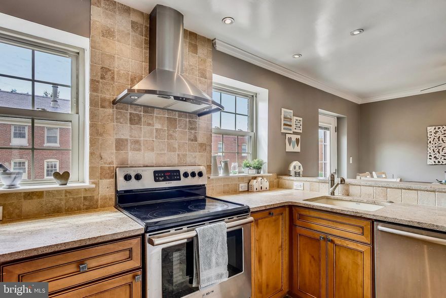 Welcome to this lovely apartment home in well established Harbor Terrace condo community in North Old Town Alexandria!  The space is sunlit, with windows on 3 sides, and is situated in the middle of the community, away from traffic noise.  Enter to a spacious living room, and continue through to the dining area open to a chefs kitchen.  If that generous living space isn't quite enough, step outside to your own deck off the dining area. Depending on your needs, the unit can be set up as two bedrooms or a bedroom plus office.  The bathroom has fresh and modern finishings, and just outside the bathroom is the convenient in-unit washer/dryer.   The flooring throughout the living area is low-maintenance luxury vinyl plank with carpeted bedrooms. (Note that the photos showing brown-tone wood flooring were taken prior to flooring update; see labeled photos for current gray/beige flooring tone!)  Tenant pays only electric and cable/internet. One resident parking pass plus one visitor pass for the unassigned community lots, and nearby street parking is plentiful as well. 1 dog or cat on a case-by-case basis with refundable pet deposit and pet rent. Strictly no smoking. Harbor Terrace has beautifully manicured common areas with multiple gazebos, benches, and picnic areas with grills. There is a bike rack, small exercise room and community room. Easy access to the Mt. Vernon trail and just about a mile walk to King Street with so much that Old Town has to offer.  Two grocery stores (Trader Joes & Harris Teeter) are within walking distance, along with many restaurants and coffee shops in North Old Town. The community is just around the corner from the GW Parkway, with easy access to Rt.1, I-395, and I-495.  Braddock Road Metro is about a 1 mile walk or accessible via bus. Available immediately.