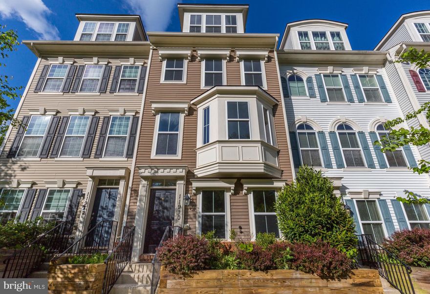 Welcome to this stunning four-level townhome offering over 2,100 square feet of well-designed living space, facing serene wooded views.

The entry level features a spacious foyer and a bright, flexible room that can serve as a home office or easily be converted into a fourth bedroom. This level also includes access to the rear-entry two-car garage.

The main level offers 9-foot ceilings and a light-filled, open layout. At the heart of the space is a beautifully designed kitchen featuring abundant cabinetry, granite countertops, and a large center island—perfect for both everyday living and entertaining. Adjacent to the kitchen is a bright dining area highlighted by a large window. Step outside to the private deck, ideal for grilling, outdoor dining, or simply relaxing. A spacious family room opens seamlessly to the kitchen and is enhanced by a charming bay window that fills the space with natural light. A powder room adds convenience.

On the upper level, you’ll find two spacious bedroom suites, each with its own full bath, along with a conveniently located laundry area—making everyday living more efficient. The primary suite offers walk-in closet and a well-appointed bathroom featuring dual vanities and a standing shower. The second bedroom also includes its own en-suite bath with a tub.

The top floor loft provides an additional private bedroom suite with a sitting area and full bath, perfect for guests, a secondary living space, or a quiet retreat.

Recent updates include fresh paint throughout and new lighting fixtures. Dual-zone HVAC ensures comfort and efficiency year-round, and the rear-entry two-car garage offers convenient parking and extra storage.

Ideally located just minutes from major routes including I-270 and MD-355, this home is close to Montgomery College, Holy Cross Hospital, the Department of Energy, NIST, Germantown Town Center, Clarksburg Premium Outlets, and Topgolf. It offers convenient access to shopping, dining, and key commuter routes. Nearby parks, playgrounds, and scenic trails provide excellent opportunities for outdoor recreation and enjoying nature.