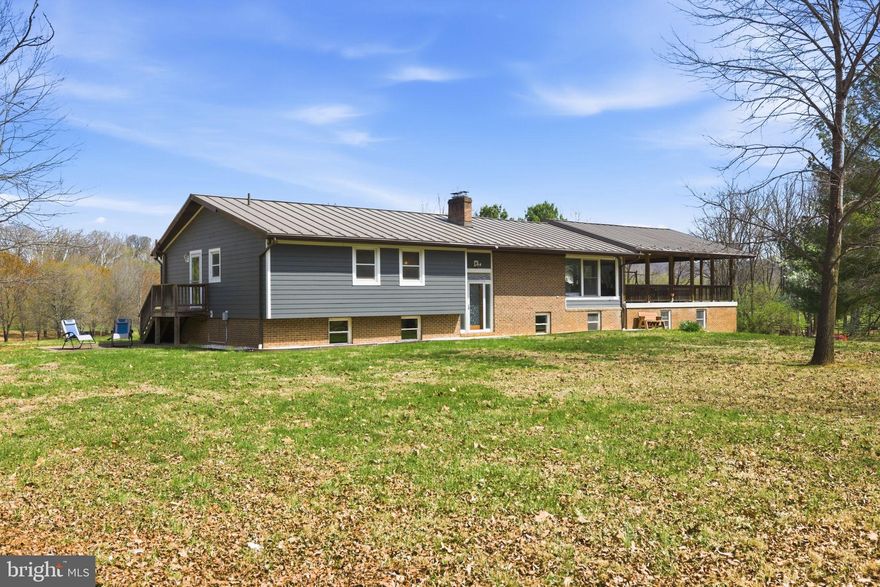 Discover the ultimate riverfront lifestyle at 1527 Shenandoah River Lane in Boyce, VA—where nature, privacy, and comfort come together in perfect harmony. With 320 feet of private waterfront along the scenic Shenandoah River, this property offers a rare opportunity to truly live on the water. Imagine kayaking at sunrise, fishing at sunset, or unwinding to the soothing sounds of the river—this is everyday life here. The level, usable acreage is framed by two wooded areas, creating a sense of seclusion while offering peaceful walking trails and a deep connection to nature. Outdoor living shines with an impressive 32’ x 32’ covered deck —an ideal setting for morning coffee, evening gatherings, or simply taking in the serene, ever-changing views. The home offers over 4,000 square feet of finished living space with 5 bedrooms and 3 full baths. Designed for both comfort and flexibility, the home includes a spacious game room, fully equipped home gym, dedicated office area, and workshop space. At the heart of the home, a cozy wood-burning fireplace anchors the expansive living room, creating a warm and inviting space to gather and relax. The formal dining room sets the stage for holidays and special celebrations. The kitchen features stainless steel appliances, offering both style and everyday functionality. The primary suite is a peaceful retreat, complete with a custom walk-in closet, en-suite bath and private patio ready for your future hot tub. Gardening enthusiasts will appreciate the large fenced garden with raised beds and 9-foot fencing, a 16’ x 24’ shed with electricity, and a 1000-gallon rain barrel—perfect for those who enjoy sustainable living and cultivating their own space. The detached garage is insulated and heated, ideal for large equipment, and includes a 275-gallon diesel fuel tank with meter, nozzle, and indoor shutoff. Modern conveniences are seamlessly integrated, including high-speed internet and a backup generator servicing essential areas of the home, ensuring year-round comfort and peace of mind. Located within the Shenandoah Farms community, residents enjoy access to amenities including a ball field, Shenandoah River recreation lots, Spring Lake, and Lake of the Clouds. Ideally situated just 20 minutes from Winchester, Front Royal, and Middleburg, this property offers the perfect balance of peaceful riverfront living with convenient access to shopping, dining, and commuter routes. If you’ve been dreaming of a home where the river becomes part of your everyday life, this is it.