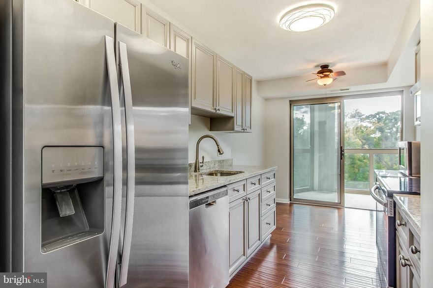 Newly updated home ready to move in!   You will be wowed when you step into this newly upgraded home!  Hardwood, Granite, stainless steel appliances, refinished cabinetry in kitchen, new frontload stacked washer and dryer, new paint, newly tiled bathrooms.  The oversized glass enclosed patio presents panoramic views of gardens and trees.  Vacant and ready for move in so see it today!