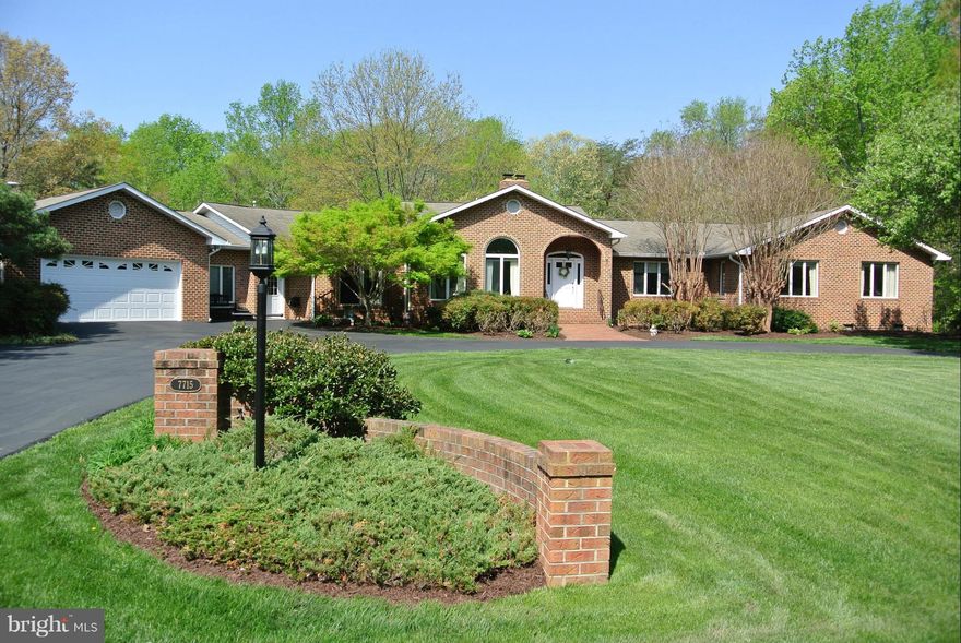 Huge Rambler with Open Floor Plan.  In Law Suite or Office Suite with Kitchen in Basement. Office On Main Level.  Den with Built In Bookcases.  Spacious Kitchen.  Third Garage Bay/Workshop High door Perfect for RV 16x32x14High with Heat & AC.  Beautiful Landscaping and Patio in rear.  Large Tree Lined Back Yard.  Move In Ready.  Great commuter location. Close to schools and shopping.