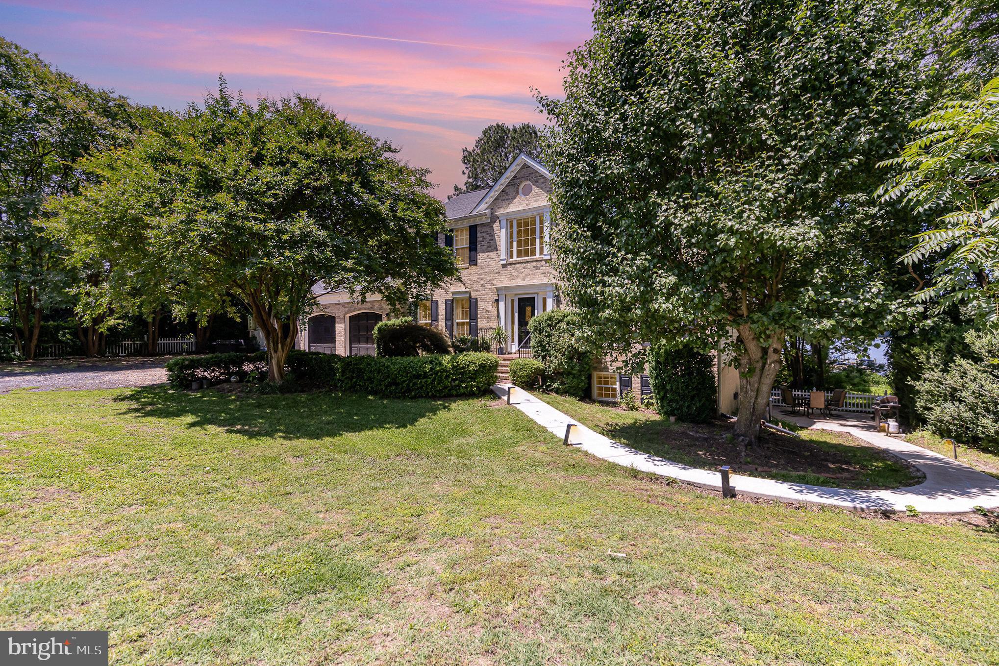 Waterfront Colonial Retreat – Only 6 Miles to Brooke Station VRE, 10 Miles to I-95 and 25 Miles to Quantico! Welcome to your dream home on the water! Being a VERY RARE find as a rental property, this stunning brick-front Colonial sits on over 1 acre with breathtaking views of Accokeek Creek, just feet from access to the Potomac River. A private, gated entrance welcomes you down a Crape Myrtle-lined driveway, leading to a classic brick walkway the front porch. Inside, you'll find a light-filled, open-concept floor plan with 5 bedrooms, 3.5 bathrooms, with a fully finished lower level with second kitchen. Some of the key features of this gorgeous property are the breathtaking water views from nearly every rear-facing window, peaceful Florida Room, hardwood floors throughout the main level, elegant trim details, cozy family room with wood-burning fireplace and open kitchen with island seating. Outside, the rear deck with hot tub and sweeping views of the creek and treetops welcomes you to sit back and relax. Shared dock just steps away from the rear of the property provides quick access to jump on your boat for fun and entertainment. Enjoy entertaining indoors or out in this peaceful, private oasis.