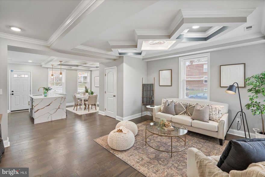 Nestled in the charming Belair-Edison neighborhood, this exquisite end-of-row townhouse exudes timeless elegance and modern comfort. Built in 1941, the property showcases classic Federal architectural style, with a sturdy brick exterior that speaks to its enduring quality. Step inside to discover a warm and inviting atmosphere, highlighted by beautiful hardwood flooring that flows seamlessly throughout the spacious layout. With four generously sized bedrooms and two full bathrooms, this home offers ample space for relaxation and entertaining. The daylight basement provides additional versatility, perfect for a cozy retreat or a vibrant play area. The corner lot enhances the property's appeal, offering a sense of privacy and a welcoming outdoor space. Enjoy the convenience of off-street parking and a driveway, ensuring that you and your guests always have a place to park. This residence is not just a home; it's a lifestyle. Experience the charm of a well-established community while being just moments away from local amenities and parks. Embrace the opportunity to create lasting memories in a space that combines classic charm with modern living. This is more than a property; it's a place to call home.