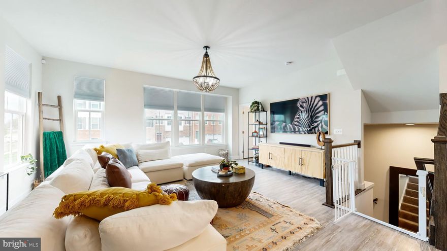 This stunning 4-bedroom, 3.5-bathroom end-unit townhome built in 2021 offers modern living with the perfect blend of style and space. Enter through the ground floor into a welcoming landing space and take the stairs to the main level.

The main level features an open-concept design with a spacious living area, kitchen, dining and half bathroom. The gourmet eat-in kitchen is a chef’s dream, boasting a large island, granite countertops, stainless steel appliances and upgraded cabinetry.  The large double-door pantry offers ample storage for groceries and extra appliances. A separate dining space offers the opportunity for more formal dinners around a large table. Off the kitchen, you'll find a private, built-in office space, perfect for working from home, and a deck equipped for outdoor dining and relaxation. Wood floors complete the modern look and feel of the main level and continue throughout the home. 

Upstairs, the primary bedroom is a expansive, sun-filled retreat with an ensuite bathroom. The double vanity offers plenty of space and storage, alongside a  spacious shower, and a separate toilet room for added privacy. The primary suite also includes a large walk-in closet with built-in shelving. Two additional bedrooms on the top floor offer ample living closet space and share a full bathroom.

The ground level features a flexible area that can serve as a fourth bedroom or an additional living space, complete with a full attached bathroom.

Outside, enjoy the fully fenced-in backyard with a patio—perfect for grilling, gardening, or relaxing in your private oasis. As an end-unit, this home offers extra privacy and quiet. The attached two-car garage features convenient epoxy flooring and extra storage. The solar panels on the roof offer an added layer of energy efficiency and cost savings to the home. 

With its thoughtful design, upgraded features, and prime end-unit location, this townhome is the perfect place to call home. Schedule your showing today!