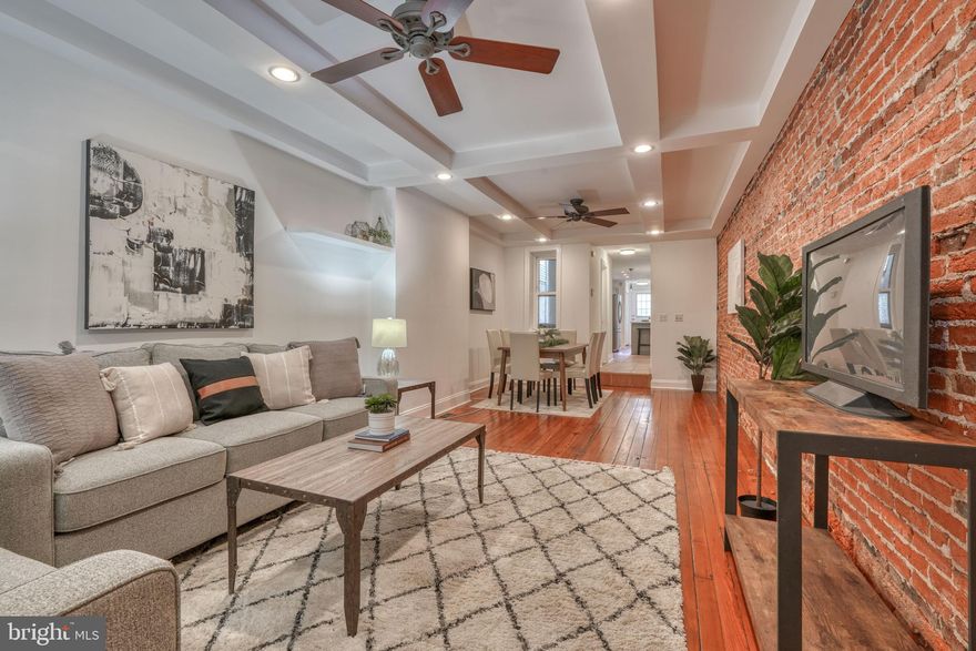 Move-in ready, full of charm, plus an off-street parking pad and a large rooftop deck... This home has it all! Enjoy tons of natural light throughout the spacious main floor, complete with a gorgeous renovated kitchen. The upper level features two bedrooms and two bathrooms, including an impressive primary suite with tons of closet space and a beautiful en suite bathroom. On the third level, you’ll find an additional bedroom and full private bathroom as well as an additional living space - perfect for entertaining - that leads out to the incredible rooftop deck. Don’t wait… Schedule your showing today!