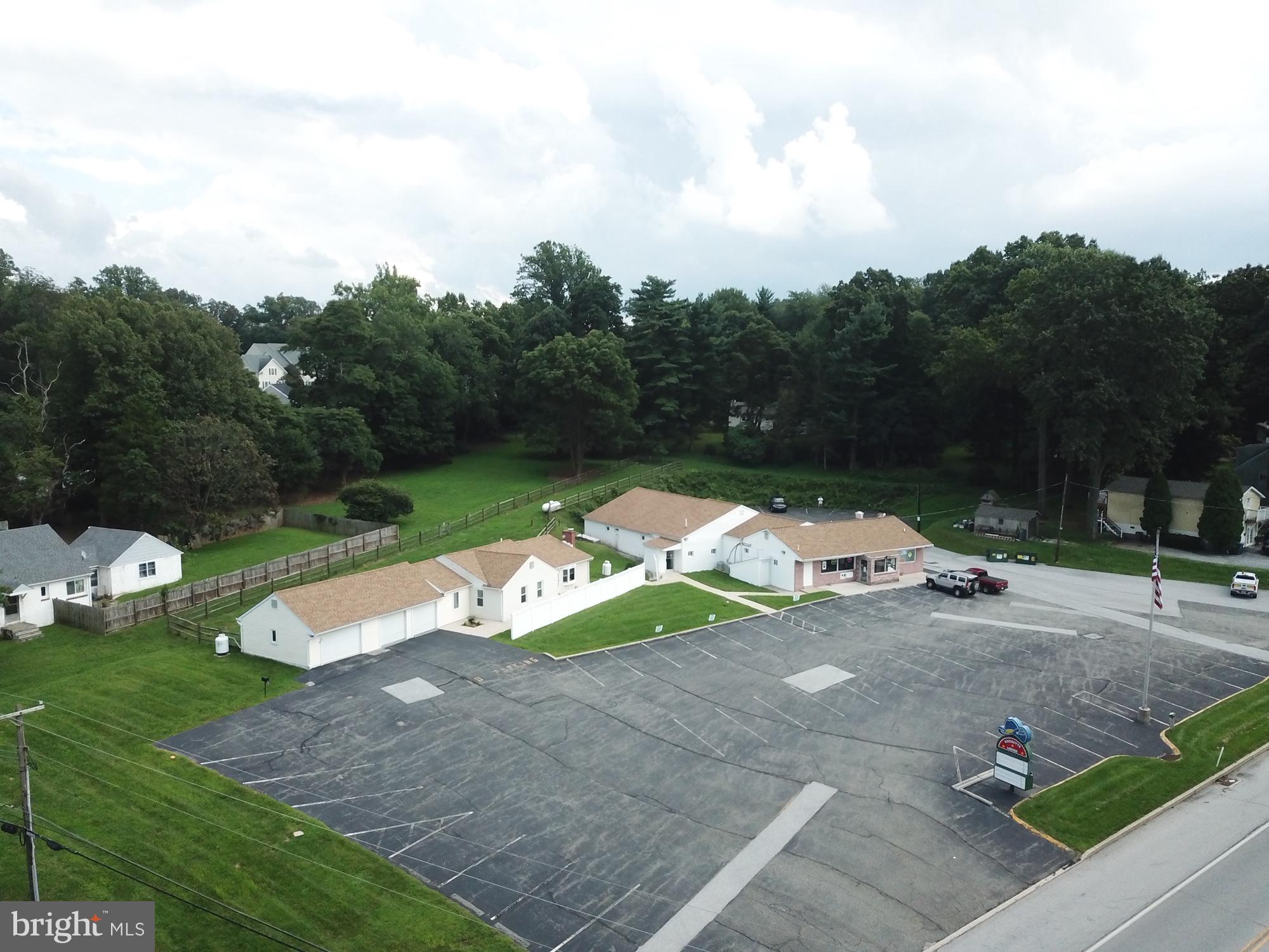 The property consists of a 5,000sf one-story commercial building operating as a bar and restaurant and a 3,000sf residence sitting on approximately 1.9 acres of land. The property is located on Route 100, a major thorofare between West Chester and Exton, PA. The Brickette Lounge has been recognized as a major destination for live country music and classic rock entertainment and was named one of "Top Country Bars In The Philadelphia Area" by CBS-3 Philadelphia. The Brickette Lounge is a renowned Chester County Bar and Restaurant with a great history. This establishment includes all FF&E including Televisions, Food, Beer, Alcohol, all kitchen equipment, all bar equipment, and the speakers and Musical Equipment from the stage. The Brickette Lounge has a large local following and also has a nice following for bands and entertainers that have performed on the stage within the Lounge. This is a great opportunity to own an establishment with a great location, plenty of parking, well maintained, and ready for the new owner to step in and take over. Also included is a move-in ready residence on the property with two bedrooms, two fulls baths, a large eat-in kitchen, and a three-car attached garage. This home is convenient, yet offers privacy from the restaurant/bar. Additional income from vending machines, lottery, pool tables, and jukeboxes. A liquor license is available at an additional cost.