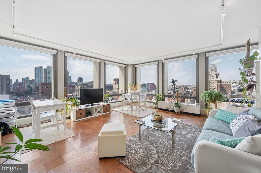 A sunny and chic condo with exquisite skyline views! Welcome to Society Hill Towers, a coveted community located in a historic pocket of Philadelphia. This 1 BD/1 BA unit offers an open living plan with wrap-around floor-to-ceiling windows, warm hardwood flooring, a galley kitchen with granite countertops and ceiling-height cabinetry, plentiful storage, and proximity to some of the city's best establishments. Whether you're sipping your coffee in the morning and watching the sun rise over the Ben Franklin Bridge or mixing your cocktail in the evening while you watch the sun set over the skyline, the sweeping 15th floor vistas will leave you speechless. The bathroom is thoughtfully designed with a glass-enclosed tub and a cohesive vanity that matches the kitchen. The spacious bedroom includes a large closet and west-facing windows. Central AC. Society Hill Towers residents benefit from 24-hour door staff, all-inclusive utilities (and cable), and optional access to premium amenities like a seasonal outdoor pool, fitness center, and underground garage parking. The buildings are situated on five acres of beautifully landscaped grounds. Steps from the Towers is Zahav, Positano Coast, Forsythia, Menagerie Coffee, Penn's Landing, and more. Minutes from the Market-Frankford line, I-676, I-95, and the Philadelphia International Airport.