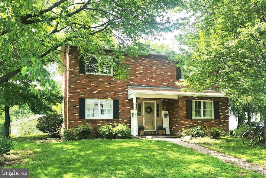 "Take Me Home Country Roads." Have you been waiting for the perfect home to become available in West Virginia? Well, here it is! This brick colonial is in the highly sought after Valley View development in Wiley Ford, just minutes from Cumberland MD. The house offers 3 bedrooms, 2 full baths and a half bath. The main level is full of charm with its bright kitchen, living room, dining room and family room with fireplace. On the upper level you will find a primary bedroom with en-suite, 2 additional large bedrooms and a full shared bathroom. There are two large walk-in storage closets in the hallway. Most of the flooring in the home has been updated within the past few years. The lower basement level offers finished space ready for you to put your personal touch on. There is a brick hearth area with a flue to add your wood stove. Ample storage space available in the unfinished portion of the basement. The home sits on a nearly flat .30 acre lot with lots of shade trees. Car enthusiast? The oversized garage was built in 2022 and is approximately 25'x36'. Make your appointment today!