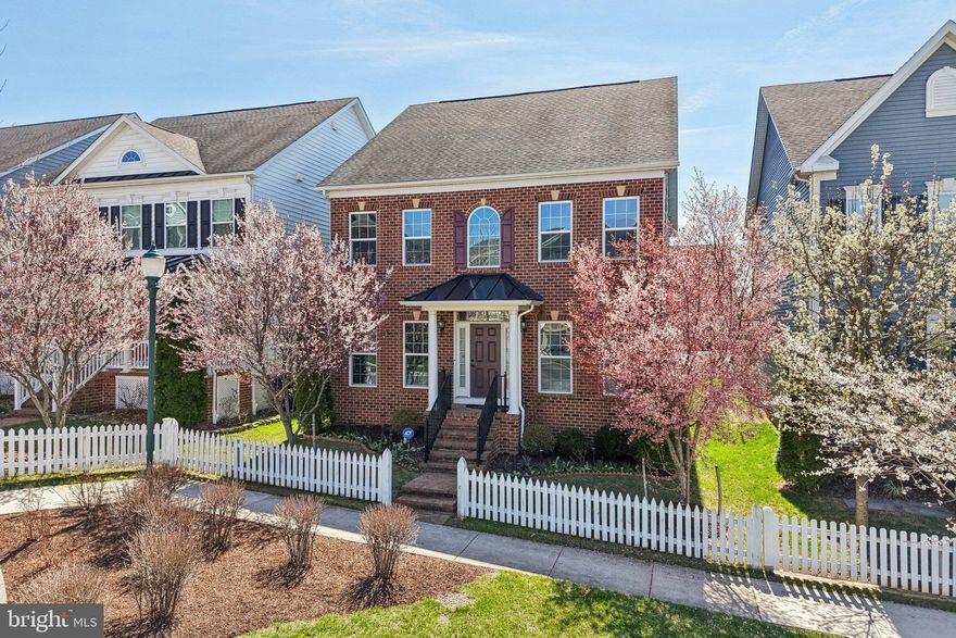 Nestled in the desirable Clarksburg Village, this exquisite 5-bedroom, 4.5-bathroom residence embodies the perfect blend of contemporary elegance and colonial charm. Built in 2016, this home is a testament to modern craftsmanship, featuring a stunning brick front and a thoughtfully designed layout that invites warmth and comfort. Step inside to discover an open floor plan that seamlessly connects the family room to the kitchen, creating an ideal space for both relaxation and entertaining. The family room, adorned with a cozy fireplace, serves as the heart of the home, perfect for gathering with loved ones on chilly evenings. The formal dining room offers an elegant setting for special occasions, while the efficiency kitchen with granite countertop is a culinary enthusiast's dream, equipped with appliances including a sleek refrigerator, single oven, dishwasher, cooktop and microwave. Every detail has been considered, from the stylish cabinetry to the ceramic tile flooring, ensuring both functionality and aesthetic appeal. Retreat to the luxurious primary bedroom where you can unwind in your private oasis. The en-suite bathroom features a sumptuous soaking tub, providing a serene escape after a long day. Convenience is key with an upper-floor laundry area, making chores a breeze. The full daylight basement, with interior access, presents endless possibilities for customization-whether you envision a home gym, entertainment space, or additional storage. Outside, enjoy the community amenities, including a pool, perfect for those warm summer days. The attached rear-entry garage provides easy access and ample parking, ensuring that your lifestyle remains as effortless as it is luxurious. This home is not just a place to live; it's a lifestyle choice that offers comfort, elegance, and a sense of community. Experience the best of Clarksburg Village, where every detail has been crafted for your enjoyment and peace of mind. Embrace the opportunity to make this exceptional property your own and create lasting memories in a space that truly feels like home.