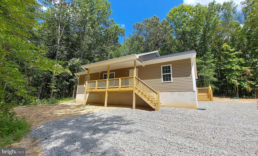 --CONSTRUCTION COMPETE! --This could be your brand new home, perfectly placed on a peaceful 2.02-acre lot in the scenic countryside of Unionville, Virginia. This beautifully crafted home offers the ideal mix of comfort, style, and rural charm.

Step inside and you'll be welcomed by an open layout filled with natural light and enhanced by vaulted ceilings that make the living space feel airy and inviting. The main living area flows effortlessly thanks to luxury plank flooring that connects each space with modern elegance.

The heart of this home is the stunning kitchen, where granite countertops with large island, shaker-style cabinetry, and stainless steel appliances come together in a clean, timeless, elegant design. Whether you're cooking weeknight dinners or hosting guests, this kitchen is as functional as it is beautiful.

Enjoy quiet mornings with coffee on the covered front porch, or host weekend cookouts on the back deck, surrounded by woods and nature. With over two acres of land, there’s plenty of room to garden, play, or simply unwind in your own private slice of Virginia.

Inside, the primary suite offers a peaceful retreat with its own en-suite bath and spacious closet. Two additional bedrooms provide flexibility for guests, a home office, or a growing household.

This home also includes access to FiberLync high-speed internet at the road—so you can stay connected while still enjoying the privacy and peace of rural life. Located in Unionville, you’ll love the easy drive to local shops and dining in the Town of Orange, Locust Grove, Culpeper, and beyond!

Don’t miss your chance to own this thoughtfully designed home in a beautiful location. Homes like this don’t come along often—especially with acreage and the opportunity to personalize!

Photos are of a previously completed home with similar finishes and layout, shown for reference only.