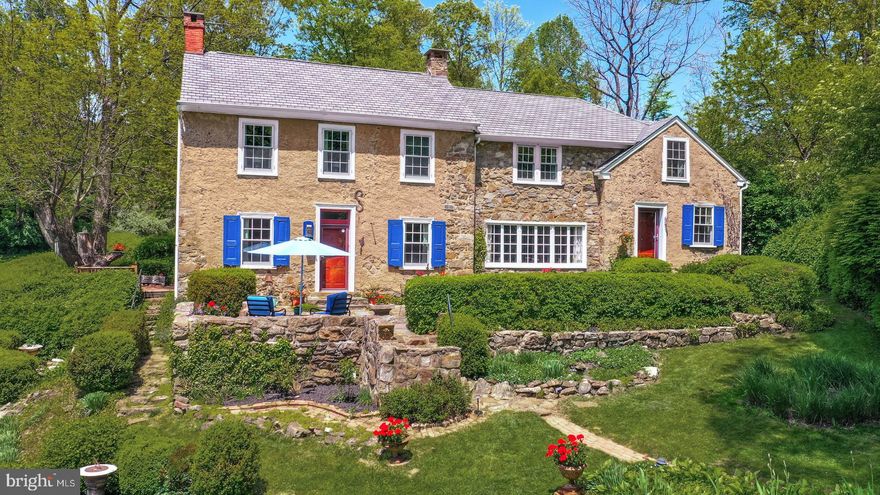 At a time when reproducible things are plentiful, there is a growing demand for an original. This historic property, with a 1780’s heritage, is perched on a hillside in one of the prettiest locations in Bucks County. It offers open skies, lush land, and glorious long distance views, all on 14 acres.  With a legacy of artists and writers, Hidden Spring is a fine example of a classic Bucks County stone colonial, with a stone bank barn and guest quarters, workshop and artist’s studio … all with views of pond and field. 600 feet above the protected valleys of Springfield Township, Hidden Spring captures the essence of Bucks County. Rich in character and comfort, the house welcomes with random width flooring, deep windowsills, antique hardware, period moldings and a plethora of architectural details, provided by time and care. A cook’s kitchen is centered between the two sides of the home, with a company-friendly center island, adjacent to a keeping room anchored by a marvelous deep set window. The first floor of the main house includes two walk in fireplaces, a wonderful dining room, and an early 1700’s room that will steal your heart. Above are four bedrooms with two full baths. This quintessential Bucks County property reveals delightful surprises at every turn. At Hidden Spring, every detail is presented artfully and joyfully, in a setting that provides seclusion in the summer and beautiful valley views in winter. This private paradise loses touch with the world just below the hills, yet is within 15 minutes of I-78, Rte 309 & the Northeast extension of the PA turnpike. Relax and let the days settle in around you.