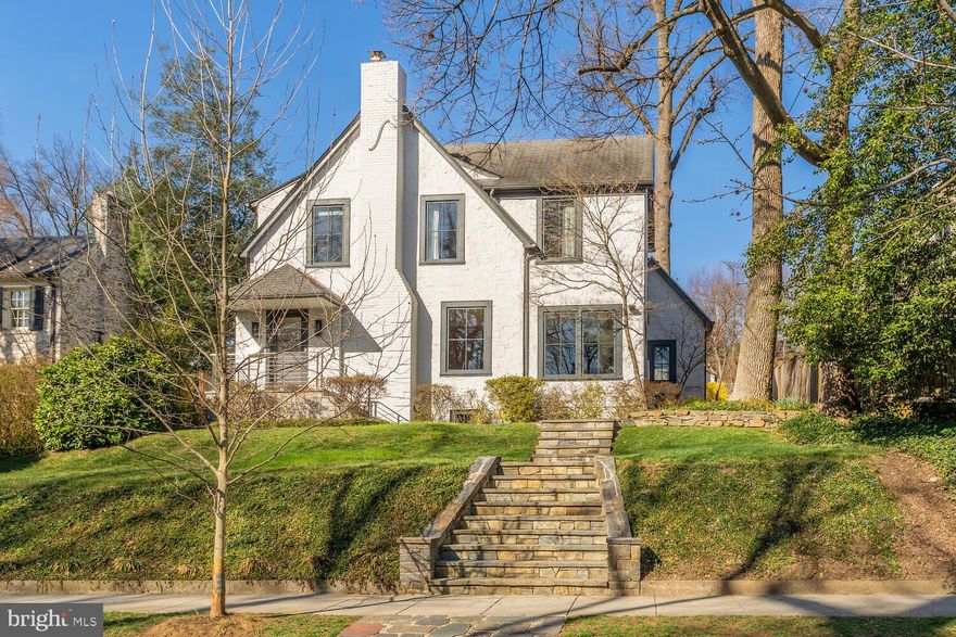 Significant Price Improvement!! Now $2,895,000. Beautiful Neo-Tudor Wesley Heights residence immaculately renovated in 2020, offers an expansive living area with views from every room, and features 5 bedrooms and 3.5 bathrooms across four levels. The current owners have carefully updated the property over 30 years, blending modern design with historic charm. The home is set back, overlooking tree-lined 44th Street, and features new Loewen windows that flood the spaces with light, including the fully finished lower level. A two-car rear garage is accessible from Cathedral Avenue and connected to the home by a flagstone walkway.

The entry opens into a bright living room with an Italian travertine fireplace, leading to a library and a newly renovated stunning kitchen and family room with soaring ceilings and large windows that look out onto a multi-level stone patio, and expansive 8,100 sqft landscaped lot (large enough for a pool) - surrounded by mature trees. Flowing spaces are a feature of the main level with the family room connecting to a spacious dining room.

Upstairs, four bedrooms and two bathrooms, including an en suite in the primary bedroom, offer ample space. A third-floor yoga/play area is accessible from one of the bedrooms. The 2017-renovated lower level includes a guest suite, a large recreation room, laundry room, and wine closet. Original refinished hardwood floors are throughout the main and second floors. This special property is near historic Georgetown, Palisades, a network of National Park trails, and a short drive to downtown DC. Also an easy walk to nearby restaurants and stores on New Mexico Avenue.