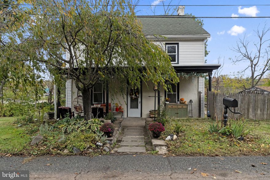 Step into the charm and character of this beautifully preserved single-family farm home, originally built in the early 1900s and thoughtfully updated for modern living. Priced as low as any townhouse in the area, this SINGLE Family/ yet Detached home is perfect for first time home buyers, couples that are looking to downsize or an ambitious investor to possibly subdivide or build on a generous 1.35 acres of land that comes with this beautiful property. Serene settings surround this cozy and quaint colonial on a picturesque no outlet private road with a small creek running in the back of the house.  As you approach, the inviting porch beckons you to relax and enjoy the tranquil views of the lush trees and woods that envelop the property. Inside, this stylish home boasts 1478 square feet of well-designed living space, featuring 5 spacious bedrooms plus den, currently used as an office and one full bathroom in the hall on the second floor.  There is plenty of space to add an additional bathroom if there is a need for it. The cozy wood stove on the first floor serves as a focal point in the living area beside the open kitchen, creating a warm ambiance for gatherings. The kitchen features an oversized raw wood countertop island, stainless steel appliances, a wine fridge, recessed lighting, stainless steel double bowl sink and a spacious pantry closet. The living room is bright and airy and has a door that leads to the fenced outdoor space. Enjoy privacy and/or solitude in the gardens of the property, perfect for unwinding in nature; or throw a huge party in the fenced flat yard and an fabulous outdoor bar/lounge area, covered and perfect for a gathering with family and friends! There is also an old barn and a storage shed close to the home, which offer space for projects, hobbies or equipment. The full basement in the house is unfinished and provides ample storage as well. Located in a peaceful setting, this property offers the best of both worlds-seclusion and accessibility. Enjoy the serenity of country living while being just a short drive from local amenities, shopping and dining options and to the charming town of Skippack Village (only about 4 miles) Skippack is renowned for its picturesque streets lined with historic buildings, boutique shops, cozy cafes, and inviting eateries. With its quaint charm, friendly community, and scenic surroundings, Skippack offers a delightful blend of small-time hospitality and timeless Americana, which makes 635 Old Sumneytown Pike residence is a rare find, combining luxurious features with a picturesque setting, making it an ideal sanctuary for those seeking comfort and tranquility, and yet so close to the fun of Skippack! Fantastic Souderton Area Schools!
