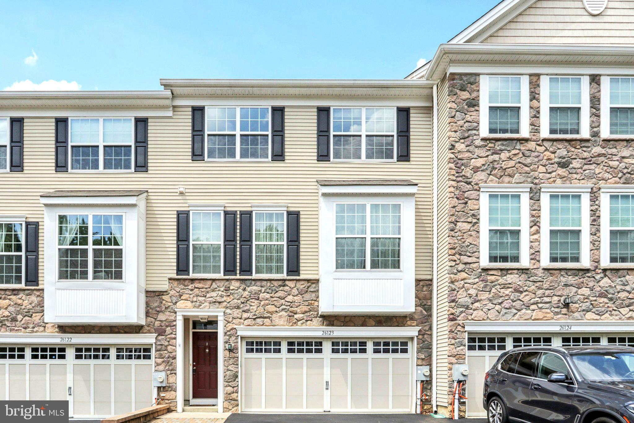 Welcome to this stunning, move-in ready home in the highly desirable community of Big Oak Crossing. Better than new, this beautifully maintained property is filled with upgrades that were thoughtfully selected during construction. The owners spared no expense to create a truly exceptional living space. Step inside and you’ll immediately notice the custom touches, including a professionally painted interior in bright, neutral tones, a custom-built entertainment center in the great room, and gorgeous hardwood floors throughout the main level. The open-concept layout flows effortlessly, making it ideal for everyday living and entertaining. The heart of the home is the ultra gourmet kitchen, sure to impress even the most discerning chef. It features 42” upgraded cabinets, granite countertops, soft-close drawers, stainless steel appliances, a gas cooktop and a double wall oven. Another bonus is a spacious pantry closet, and an oversized island complete with built-in microwave and additional storage. Adjacent to the kitchen is a generous breakfast room/dining area that comfortably fits a large dining table. This space also includes a unique builder upgrade offering a double built-in desk area with granite countertops and extra cabinetry that is perfect for work or homework. From the dining area, sliding glass doors lead to a private elevated deck, ideal for morning coffee or evening unwinding. Upstairs, the spacious primary suite features elegant tray ceilings, a large walk-in closet, and a luxurious en-suite bathroom with double sinks and quartz countertops. Two additional bedrooms, an upgraded hall bath, and a convenient laundry room with Samsung washer and dryer complete the upper level. The lower level adds even more living space with a bright and versatile room that can serve as an office, den, or a play room. Another standout feature is the upgraded half bath on this level, a rare addition in this community. Sliding doors open to a private paver patio, offering even more outdoor enjoyment. Big Oak Crossing is centrally located near Oxford Valley Mall with quick access to I-95/295, Route 1, and the PA Turnpike. A commuter rail station with a parking lot is just two miles away, making this location as convenient as it is charming. This home is a rare find in today’s market! It is beautifully upgraded, impeccably maintained, and ready for its next owners. Contact the listing agent today to schedule your showing before it’s gone!