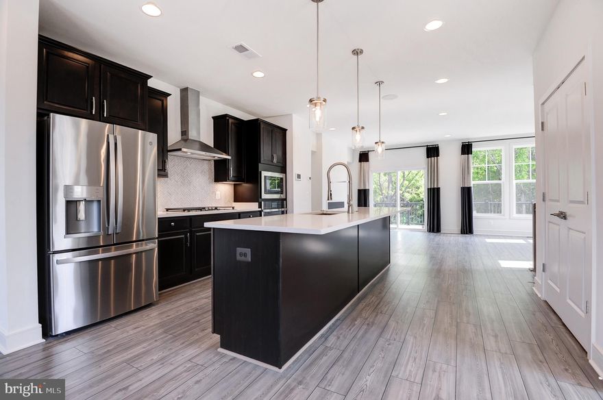 Previously a BUILDER MODEL HOME at Lake Frederick! END CORNER TOWN HOME backs to WOODS!! Never lived-in!!! <br> <br> Rent includes HOA fee & Lawn maintenance that includes mowing at front, back, & side yards. Mulching included as well <br> <br> Lake Frederick is a gated, master-planned resort setting sub division, where privacy & peace are @ its forefront. This charming community is tucked in the serene Shenandoah Valley, midway between Winchester & Front Royal cities where one can enjoy conveniences of both cities & yet, experiene the tranquility of nature. Breathtaking mountain views, amazing sun rises, & serene sun sets over the Blue Ridge Mountains <br> <br> This sub-division boasts outstanding engaging lifestyle amenities. CLUB HOUSE: Outdoor pool & gym | SHENANDOAH LODGE/ATHLETIC CLUB: Access to UPPER level activities | ONSITE REGION'S 117 RESTAURANT & BAR: Award-winning, highy rated, farm to table restaurant. A great meeting place to enjoy lunch/dinner or to watch a game together | ONSITE  LAKE FREDERICK: Stunning 117-acre lake! Breathe into an early morning scenic walk or run or a relaxing kayaking or fishing at this lake | Sports courts, tennis courts, pickleball, tot lots, community parks, dog parks, fire pits, & miles of walking trails <br> <br> Minutes away to Shenandoah National Park, scenic Skyline Drive, & Appalachian Trail | Nature, shopping, dining, fitness, movies, restaurants, meeting places, parks, six nearbygolf courses | Quick access to major interstates I-66 & I-81, Rte 340, Rte 7, ensuring a seamless connectivity to the region<br> <br> Lake Frederick has it ALL! Excellence in style, function & location. Offers an exceptional balance between modern living, joys of natural beauty, sun-drenched life, great outdoors & a laid-back lifestyle centered around enjoying time w/ friends, providing residents a unique & enriching living experience <br> <br> 3 level, 2,250 sq ft interior FINISHED, 3 spacious bed rms, 3 full baths, & 1 half bath | Front door to the side of the home | Attached, front load, 1 car garage, but 2 car driveway, equipped w/garage door opener & keypad. Ample car parking spaces for quests | 9 ft. ceilings | Natural light gushing in thru abundant windows thru out the home| Oak staircase all thru the flights | LED lighting thru out the home | Security cameras available if required | Ceiling speakers | Walk-out homesite <br> <br>  Vanmetre built, Nicholson floor plan, offers an open moden concept that accomplishes contemporary living w/all the space & style, versatility & functionality; where comfort & convenience merge seamlessly <br> <br> The MAIN level is the heart of the home w/beautiful LVP floors all thru | The GOURMET kitchen in the center w/large center island is a hosting spot w/its seamless flow, creating a distinct dining & living areas to its either sides making entertaining a breeze. SS appliances, cooktop w/hood, & wall oven layout (not many townhomes here have this layout),refrigerator w/water dispense, large undermount sink, quartz counters, backsplash, & pendant lights | Tucked in nook to cater to your needs & imagination; an ideal home office or kids homework area or a creative craft area | A powder rm | Long pantry closet | Huge deck off of the living area gives an extention to the living space <br> <br>  At UPPER level are the 3 spacious bed rms; the primary bed rm w/tray ceiling & a large walk-in closet. Primary bath has dual vanities, a walk in shower w/frameless enclosure, & a big size window | The two scondary bed rms down the hall share a full bath rm | Linen closet | Washer & Dryer closet w/cabinets <br> <br> The LOWER level features a cozy rec area w/closet, storage area, & full bath; rec area is perfect for a game room or home office | Nice patio space off of the rec rm, enhances outdoor living