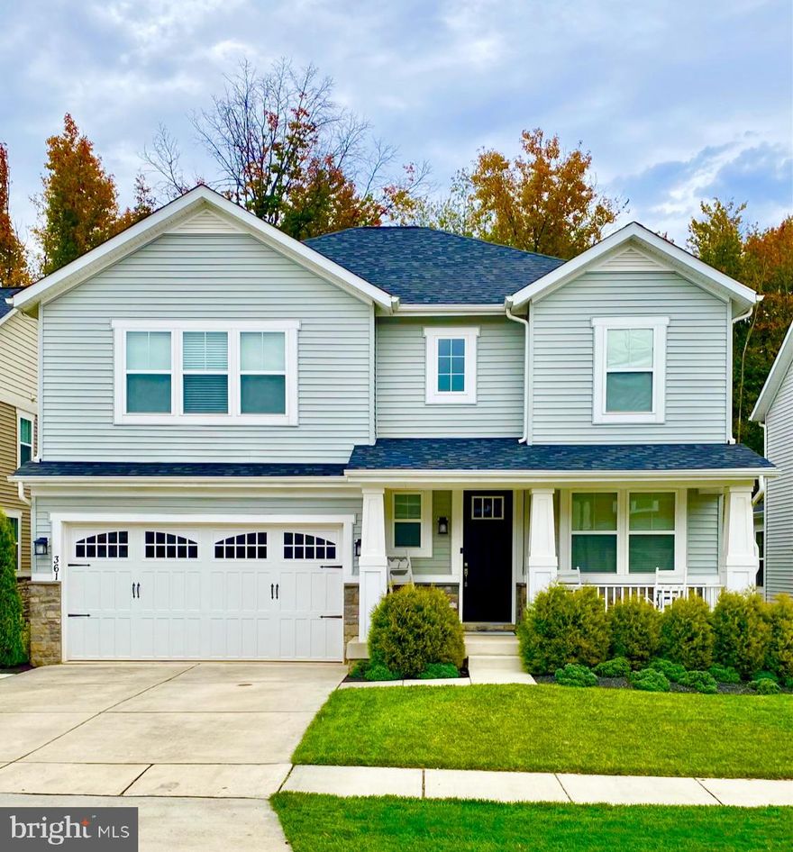 Beautiful Tanyard Cove Community Craftsman Style Home with Covered Front Porch and 2 Car Garage.  Stunning private backyard with large 12' x 18' Fiberon composite deck,  15' x 26' paver patio and built in wood burning fire pit.  Convenient concrete walkway from front of house to patio.  Bright open floor plan with hardwood floors throughout. Family Room has Cozy Gas Fireplace which overlooks Gourmet Kitchen with Shaker Style Cabinets,  Stainless Steel Appliances, Pantry, and  oversized chef's island with granite countertops and plenty of recessed lighting. Gorgeous Morning/Dining room with surrounding windows allowing lots of natural light and overlooking the backyard that backs to trees for privacy.  Office/Den on main level with Glass French Doors makes working from home a delight.  Upstairs has 4 Bedrooms,  the Owner Suite  has a walk in closet and adjoining Private Bath with dual Vanity and shower,  3 additional large bedrooms, Full Bath has double sinks with tub/shower. Upstairs Laundry and additional loft area to sit and read with all the natural light from two story foyer.   The Finished lower level has a huge recreation area, with built in wet bar and includes wine/refreshment fridge. Lower level has 5th Bedroom/In-Law Suite with walk in closet, Full Bath and large storage area.   The home has Simplisafe alarm and Ring doorbell and Ring Floodlight.  Community is close to commuter routes, shopping, dining and BWI.  Built by Richmond American Homes in 2017. Beautiful Water front community with lots of activities!