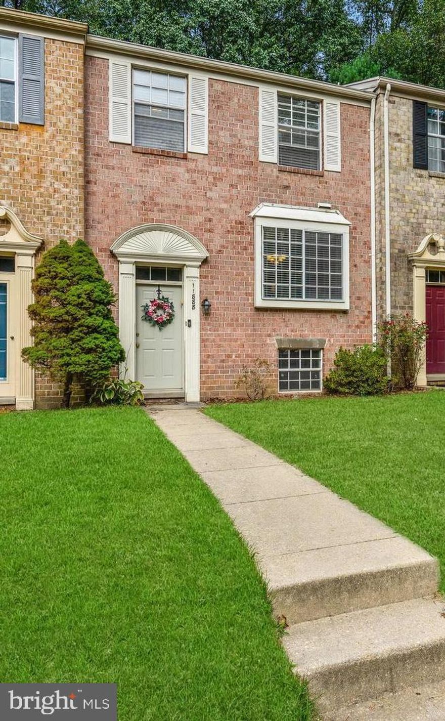 Impeccable brick front townhouse that has all the upgrades you can dream of!  This home has a renovated kitchen with Stainless Steal appliances, Maple Cabinets, Granite Countertops and custom backsplash.  The main level features lovely Hardwood floors leading to a balcony that is great for entertaining.  The lower level offers a 4th bedroom, full bathroom and  a Family Room  with a wood burning fireplace! Rest easy in a sprawling owner's suite with a private balcony!  All of the bathrooms have been renovated.  Come see this well-kept home and make it your own!