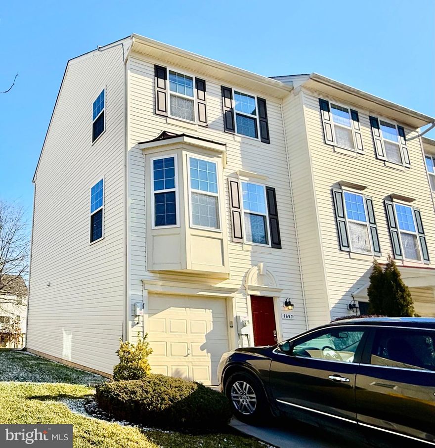 This beautiful end-unit home is filled with natural light and showcases numerous fresh updates throughout. As an end unit, it features additional windows that brighten every level, creating a warm and inviting atmosphere. Recent upgrades include new carpet throughout, new kitchen flooring, new stainless steel kitchen appliances, and a new front loading washer and dryer. Elegant window moldings add a refined touch, while extra storage beneath the stairs enhances everyday functionality.  Energy-efficient solar panels convey and the Solar Power Purchase Agreement will transfer to the new owners, offering long-term utility savings.

The main level offers an open-concept floor plan ideal for both everyday living and entertaining. The modern kitchen features sleek finishes and a large island, flowing seamlessly into the dining and living areas. The living room is highlighted by a beautiful bump-out bay window that adds charm and abundant natural light.

Upstairs, you’ll find two spacious primary suites, each with its own private en-suite bathroom. The owner’s suite includes a walk-in closet and a dual-vanity bath, offering a true retreat.   The lower level provides a half bath, laundry and utility area, and direct access to the attached one-car garage. Fresh paint throughout the home completes the move-in-ready appeal.

Outside, enjoy the large yard—perfect for entertaining, grilling, or relaxing outdoors. Located in the sought-after Tanyard Springs community, residents enjoy resort-style amenities including a pool, splash pad, 24-hour fitness center, tennis and basketball courts, dog park, community garden, playgrounds, picnic areas, and miles of scenic walking and running trails.

Ideally situated for easy commuting to Baltimore, Washington, D.C., Ft. Meade and Annapolis, this home offers the perfect blend of style, comfort, and exceptional community living.