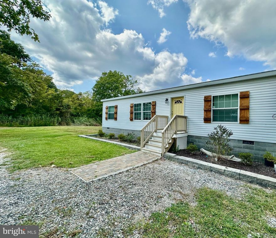 This 3.64-acre property is located on the Wicomico River with over 216' of shoreline. This homesite sits facing the river, has three bedrooms and two baths, and has been recently remodeled with vinyl plank
floors, updated baths and kitchen, rear deck, freshly painted interior, custom wood shutters, circle drive, owner suite with custom tiled bath , new 30 year architectural shingled roof, HVAC, and single-level living.
Enjoy sunsets from the rear deck of this home, or take a walk down your own private beach. Great fishing spot and the property sits directly across the water from the Red Roost Restaurant.