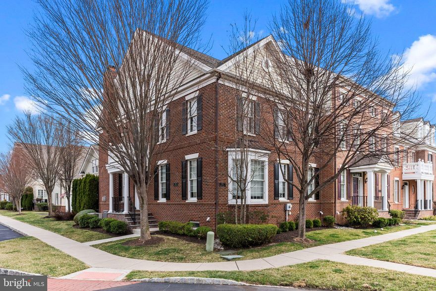 This pristine, upgraded Sequoia model in Newtown Walk is situated in a superior location, and offers an entry that enhances the feel and look of a single-family home. Beautifully appointed with four levels of living space and totals 5000 square feet, this stunning residence features an open floor plan and sun-filled rooms that provide an abundance of natural light. Gleaming hardwood floors, custom millwork, and a beautiful deck are just a few of the impressive details. The welcoming foyer leads to a formal living and dining room, an inviting family room boasting a gorgeous gas fireplace and access to the lovely deck. The upgraded and customized kitchen is a chef's dream, complete with granite countertops, stainless steel appliances, and an expanded island with a custom bar area. The private deck offers a perfect oasis for summer entertainment. The finished loft above the garage provides versatile flex space, ideal as a beautiful office. The second level highlights a lovely primary suite with an elegant bath, two additional bright and airy bedrooms, a full hall bath, and a convenient laundry room. The third level is finished as a full suite with a private bath, adding additional comfort and privacy. The finished basement is a must-see, featuring Brazilian hardwood floors, a custom bar for entertaining, and ample space for playing or relaxing. An additional bedroom and full bath complete this level. The home's brick and Hardie Plank exterior is enhanced by lush landscaping and a full irrigation system. Located in the desirable Newtown Walk community, just minutes from exciting Newtown Boro, residents can walk to shops and restaurants. The Roberts Ridge Park is a 22.8-acre park located adjacent to the community. It is home to a large inclusive playground, restrooms, picnic tables, and benches making a visit to the park enjoyable. The Newtown Trail also traverses Roberts Ridge Park allowing walkers to access Newtown Borough, Silver Lake Park, Carl Sedia/Chandler Fields, and Tyler State Park. Convenient access to trains and major roadways makes travel to Philadelphia, New York, and Princeton a breeze. Only 20 minutes to Mercer Airport! This exceptional home offers comfort and style in every season—Come visit, and you will want to make it yours!