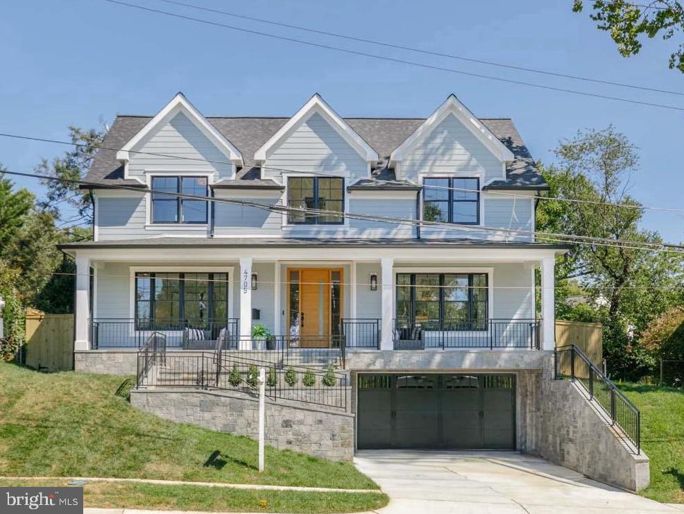 Perched on a hill in Kensington's cherished Parkwood neighborhood, another ERB favorite drenched in natural light and amazing entertaining space! Enter to herringbone wood floors separating formal living and dining rooms overlooking the elongated front porch. Escape to the back family room with enormous gourmet kitchen featuring long center island, 6-burner gas stove and pantry wall. Holidays made simple with its extra large butler pantry featuring wine bar, beverage fridge and additional double door walk in pantry. The kitchen opens to an informal dining nook and enormous family room with double doors to a private back yard. The upper floor's vestibule leads to a large primary suite with double walk in closet and spa-like bath with soaking tub, oversized shower and double vanity. In addition, enjoy a shared bath like no other with extra large picture window, separate large vanities and large shower room flanking two generous bedrooms each with double closets. To complete the top floor, enjoy a private guest room w/ ensuite bath and walk-in laundry room with storage, folding center, and sink. The lower level has large kitchenette, separate walk-out entry, private gym and guest room with dual-entry full bath. Enjoy the fully-fenced yard with privacy wall and slate patio. All this across from Parkwood Elementary and blocks to Rock Creek Park's weekend walking paths! Enjoy easy commuting while tucked away in the sidewalk-lined streets of Parkwood. Moments to Kensington fan favorites like Antiques Row, Frankly Pizza, farmers market, and more!