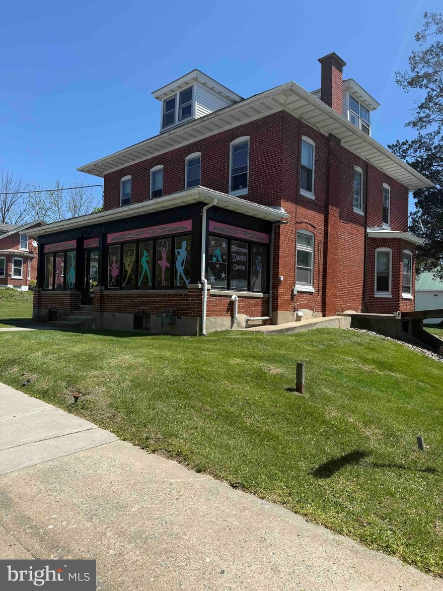 Property Highlights • Flexible Layout: This three-story building offers a versatile floor plan, allowing for up to three separate units. The lower level, with its own exterior entrance, was previously utilized as a medical office, making it ideal for professional services or retail. (Please confirm allowed uses with Maxatawny Township zoning) • The main and upper floors feature a spacious 8 room, 2-bathroom, complemented by a walk-up attic suitable for additional storage or potential expansion. • Detached Garage/Barn: A separate structure at the rear includes a three-car garage with a full second floor, providing ample storage or workshop space. • Prime Location: Situated on Main Street (Route 222), the property enjoys high visibility and is just minutes from downtown Kutztown and the local shopping center. Its proximity to Kutztown University adds to its appeal for both residential and commercial purposes. • Utilities & Features: The building boasts hardwood and vinyl flooring, gas heating, and a traditional architectural style with brick and wood siding. Owner is relocating business in August. Potential for a short term leaseback.