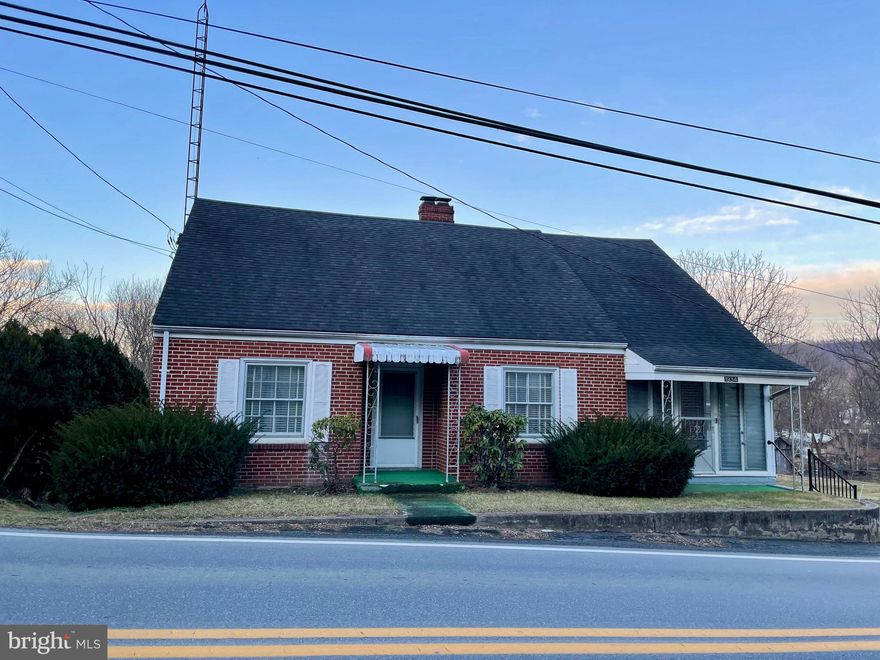 Craftsman style home on incredible lot in the desirable South Berkeley area. Many original details remain, including arched doorways, plank wood floors, built-in cabinetry, and antique door knobs. The main floor offers 3 bedrooms and full bath. The main bedroom offers an additional room for a study or nursery, large picture window, and direct access to the rear sun porch. A fourth bedroom or office is located on the second level, with potential for additional living space to be finished upstairs. Brand new stainless steel kitchen appliances convey. Enjoy the expansive rear yard with view of Mill Creek. A large back porch offers ample space to relax, offering double hung windows for a true 3-season room. The rear porch also provides a covered entertainment area below. This home features a convenient parking area, and adjacent storage building. Please note that the floor of the garage structure is wooden, and there are no known water/sewer utilities to the adjacent storage building. Home is being sold as-is.